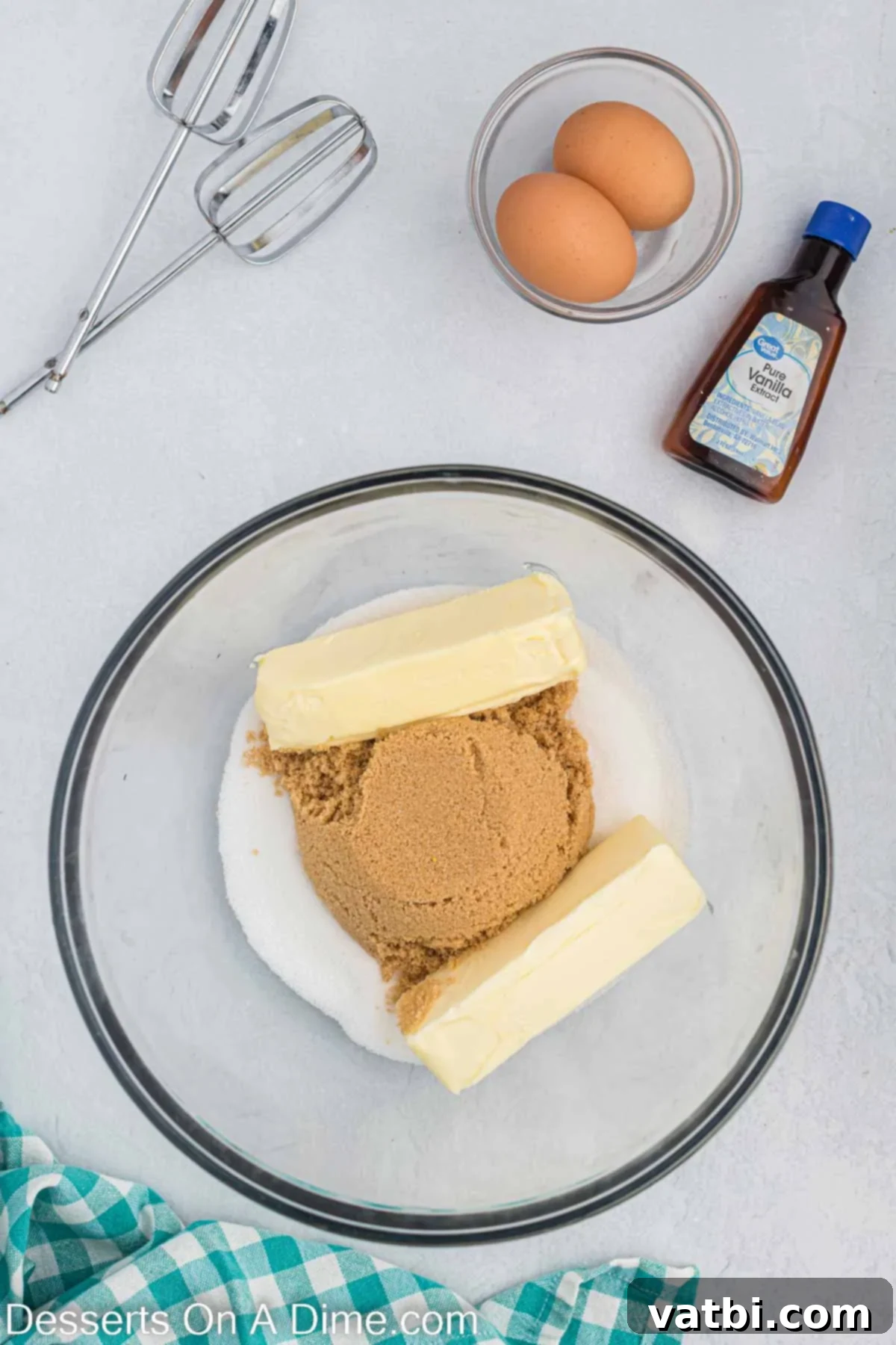 Step 1: Creaming softened butter with granulated and brown sugars in a mixing bowl for the perfect chocolate chip cookie dough base. Room temperature butter and both granulated and brown sugar being creamed together in a large mixing bowl with an electric mixer