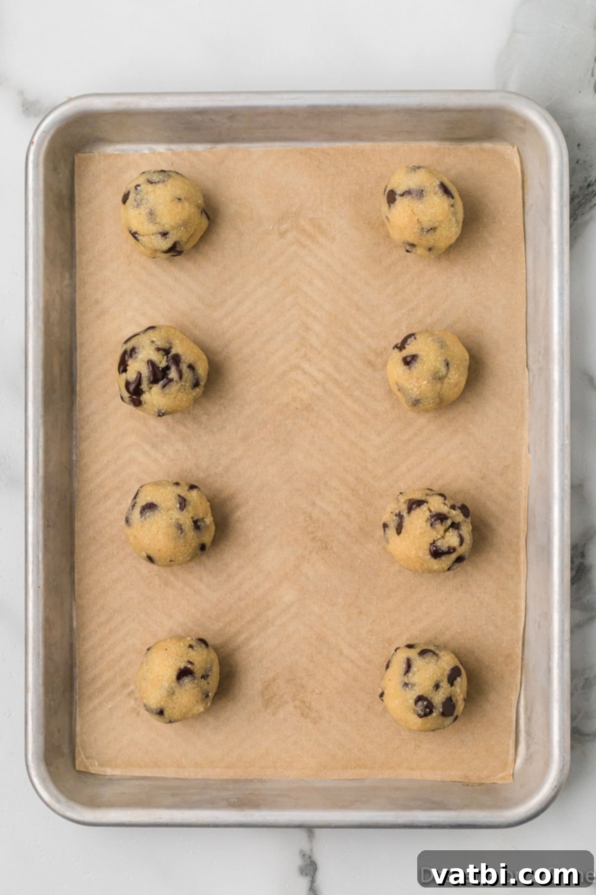 Edible Keto Cookie Dough Delight 7 Dough balls placed on cookie sheet.