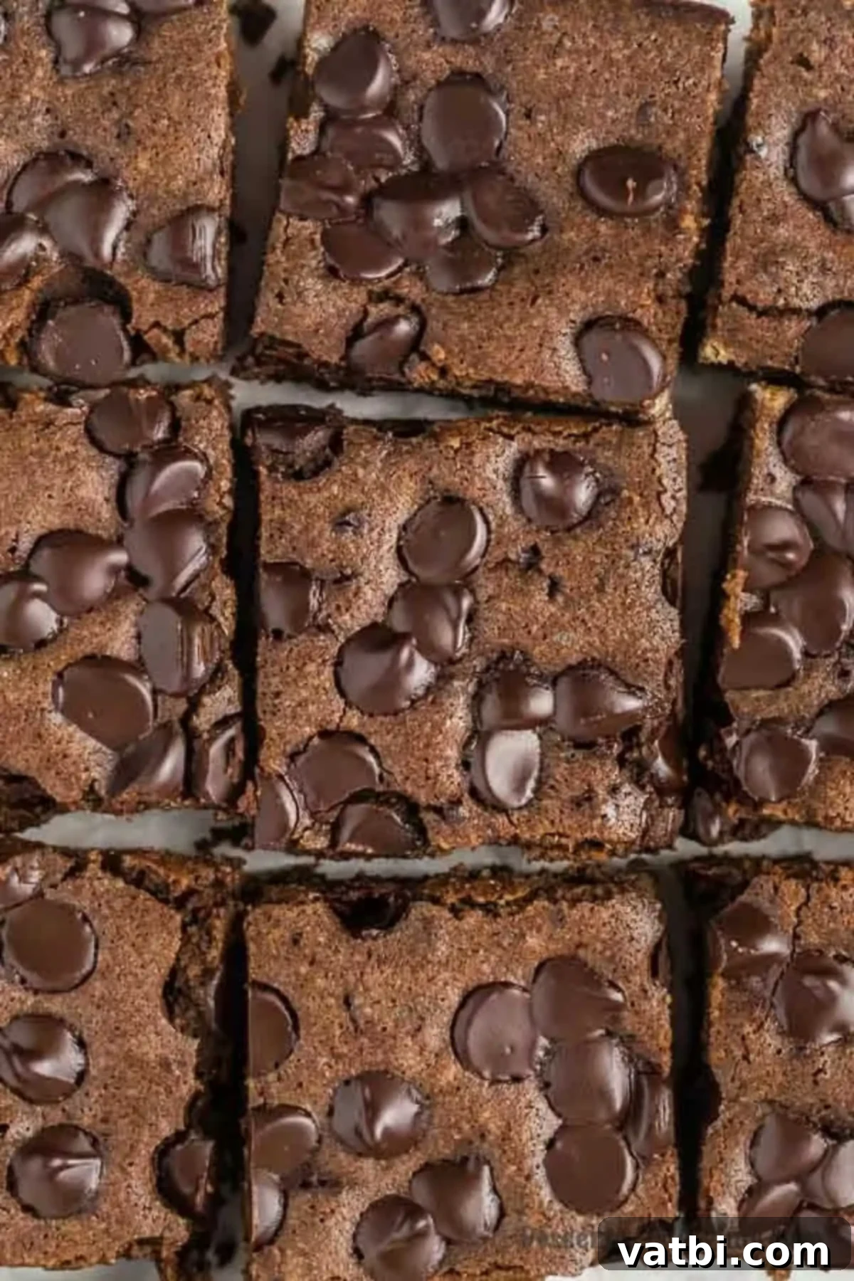 Keto brownies are so delicious and such an easy low carb treat that everyone will enjoy. This easy recipe makes the best fudgy gooey brownies with cocoa powder. Try this simple and healthy easy low carb chocolate brownie recipe with almond flour. The worlds best easy fudgy chewy brownie with just a few ingredients. #dessertonadime #ketobrownies #easyalmondflour #ketobrownieseasy #recipes Perfectly sliced Keto Brownies, showcasing their fudgy texture and rich chocolate color, ready to be enjoyed as a low-carb dessert.