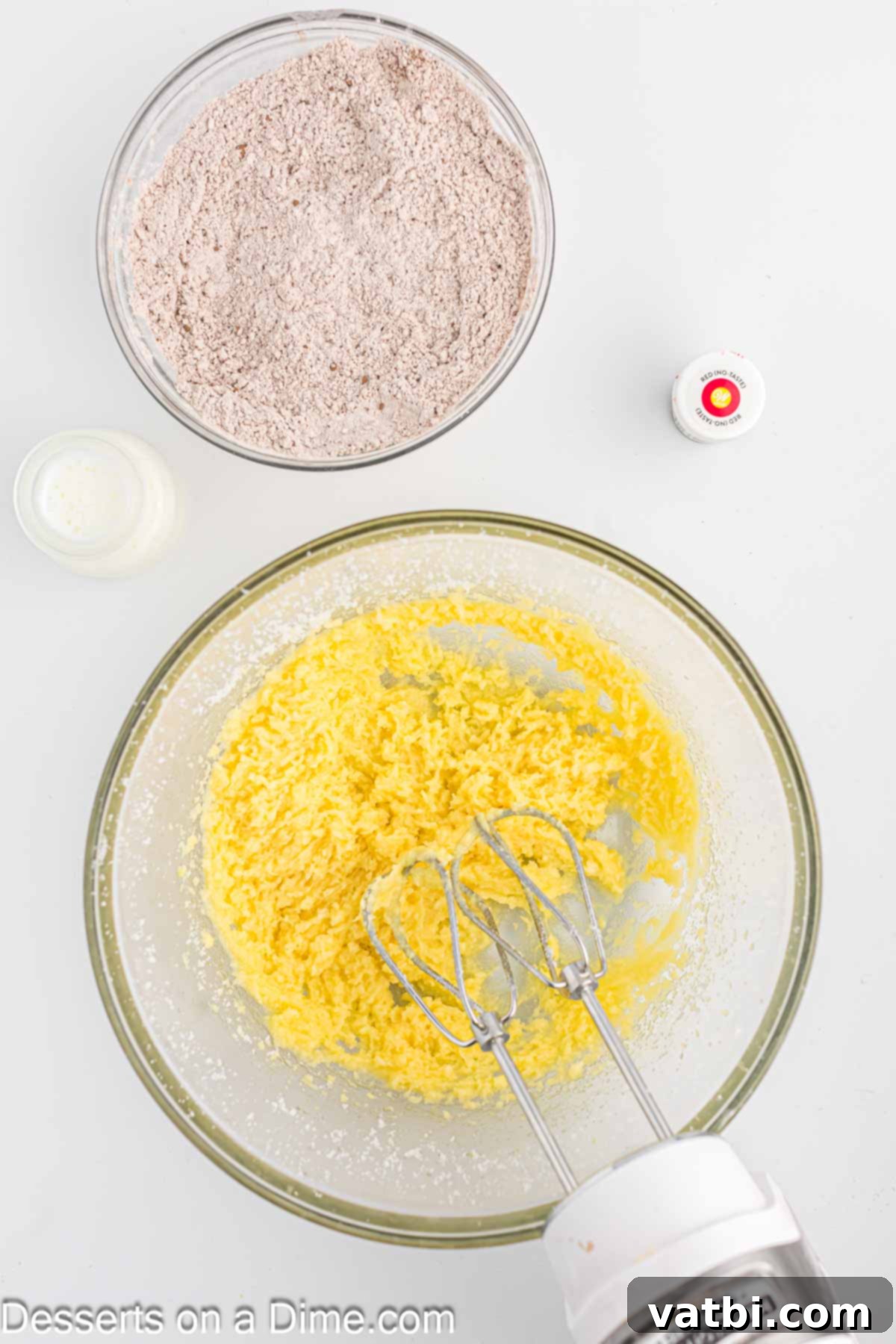 Creamed butter and sugar mixture in a mixing bowl, light and fluffy.