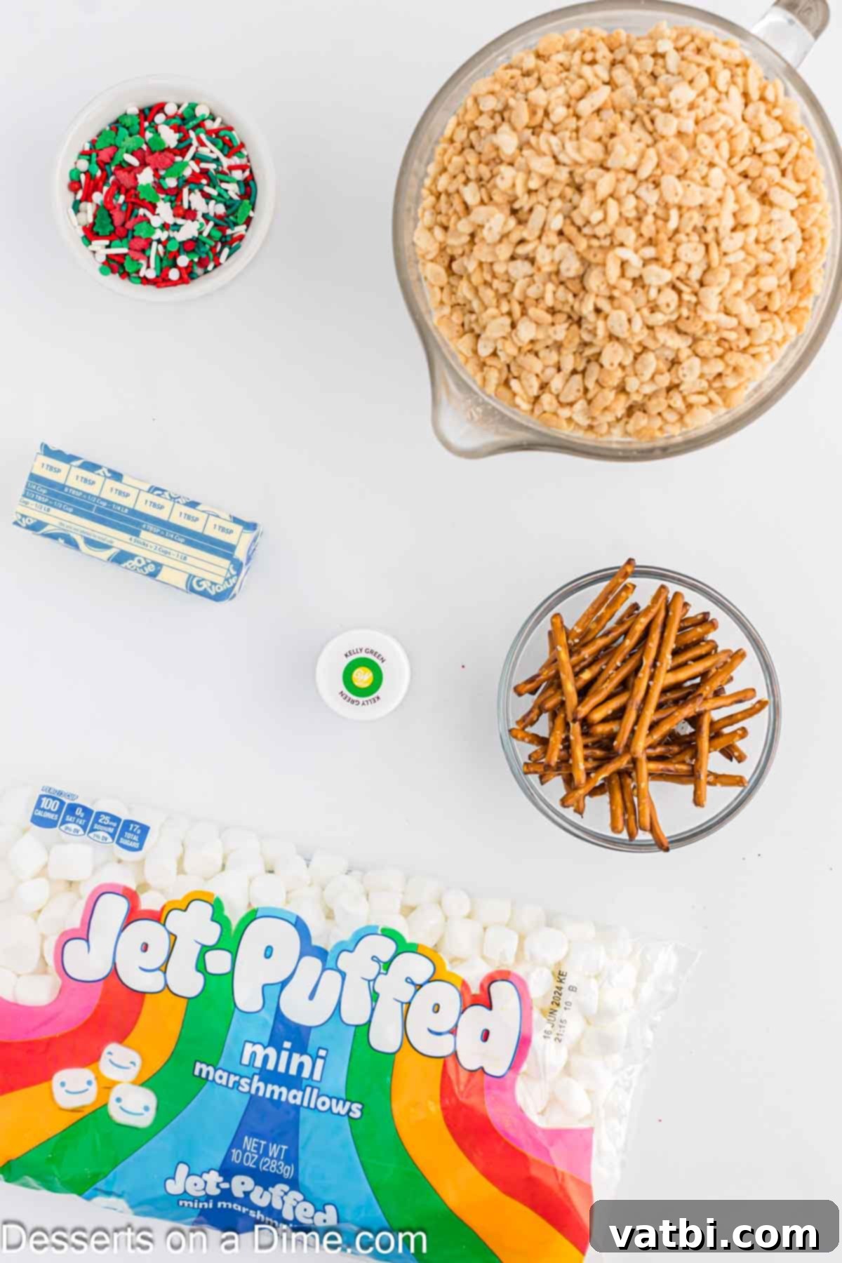 Rice Krispie Christmas Trees 3 Ingredients for recipe - butter, mini marshmallows, green food coloring, sprinkles, pretzel sticks.