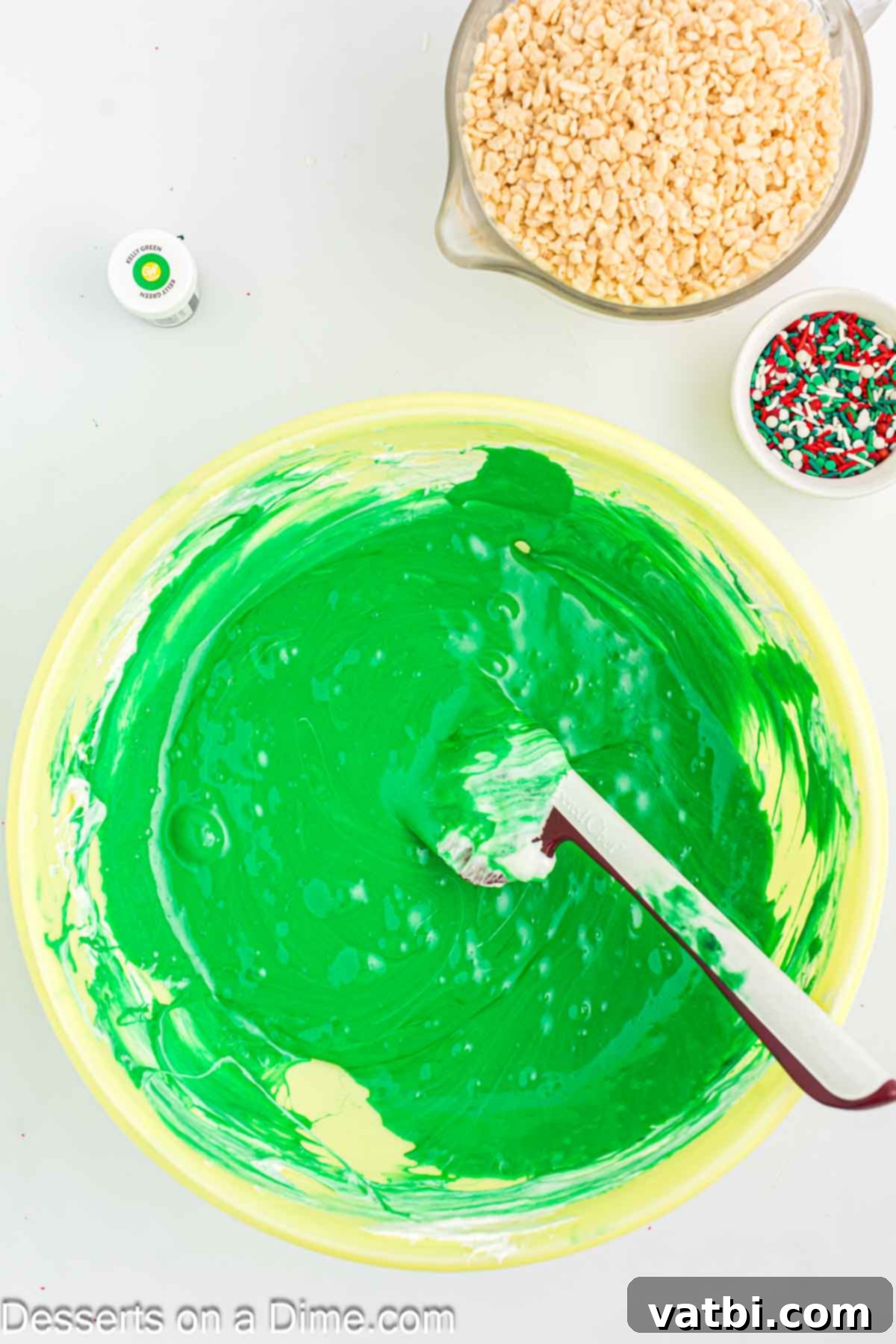 Rice Krispie Christmas Trees 4 Mixing bowl with melted marshmallows with green food coloring.