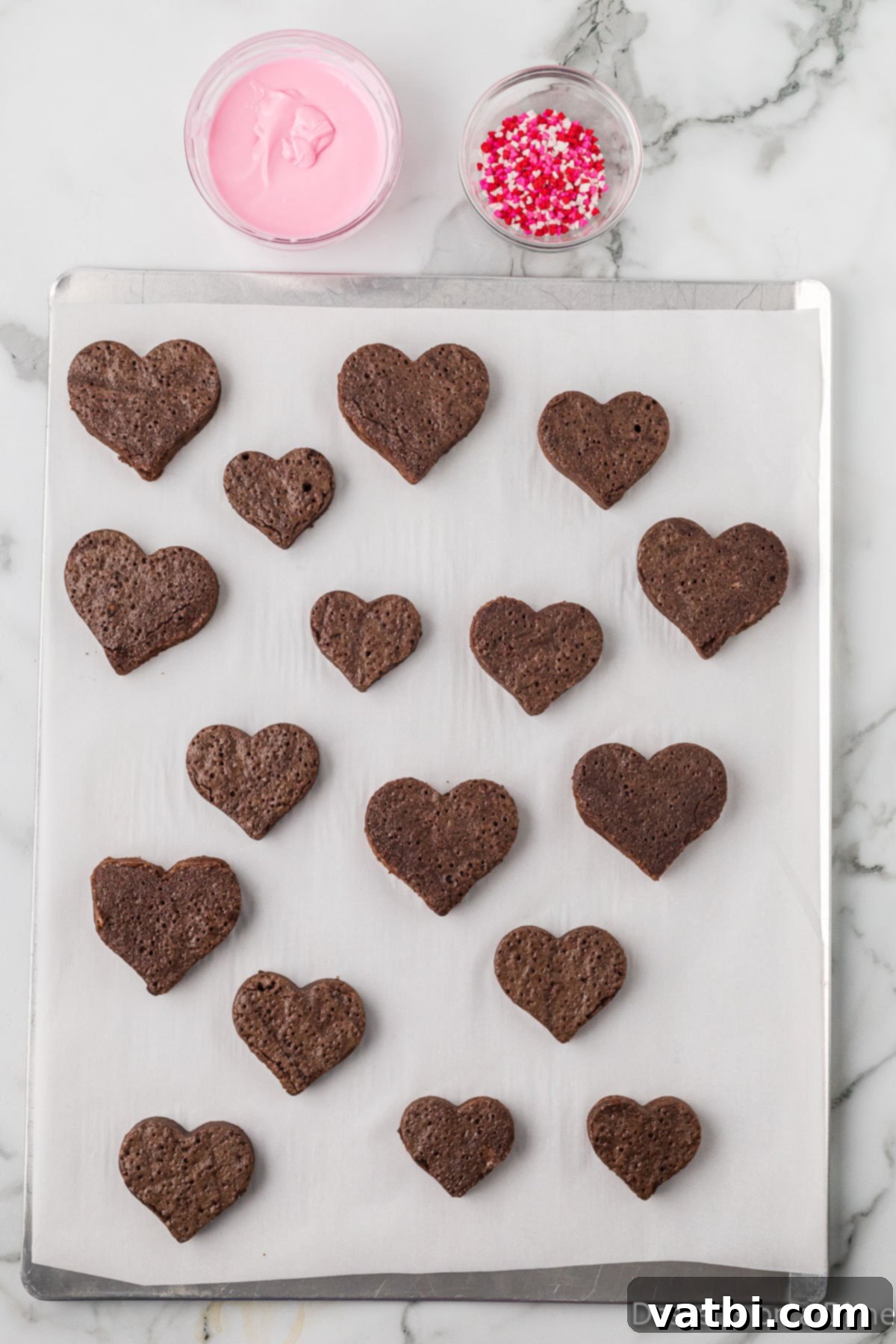 Sweetheart Brownie Delights 8 Heart-shaped brownies neatly cut from a larger baked brownie slab, showcasing their festive form.