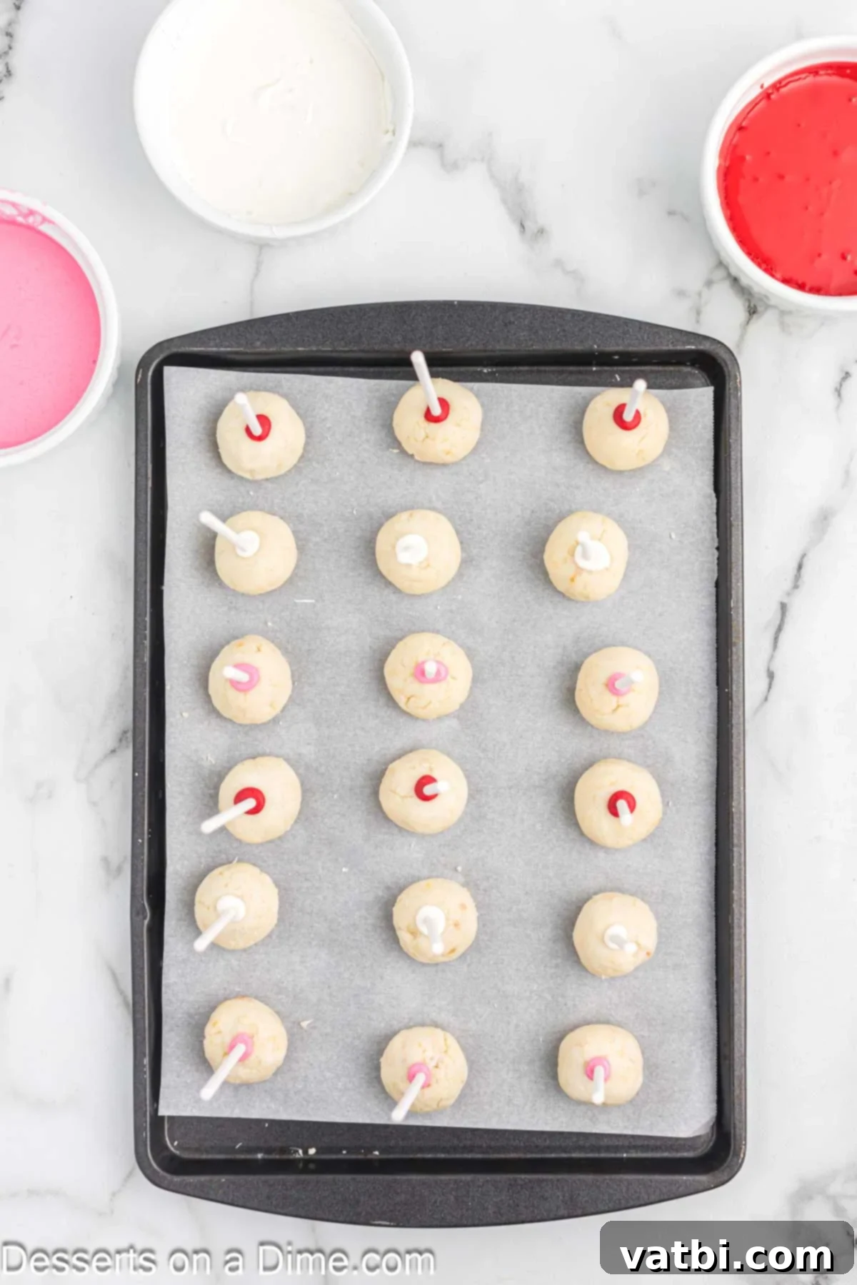 Sweet Valentines Cake Pops 8 Sticks added to each cake ball and placed on baking sheet.