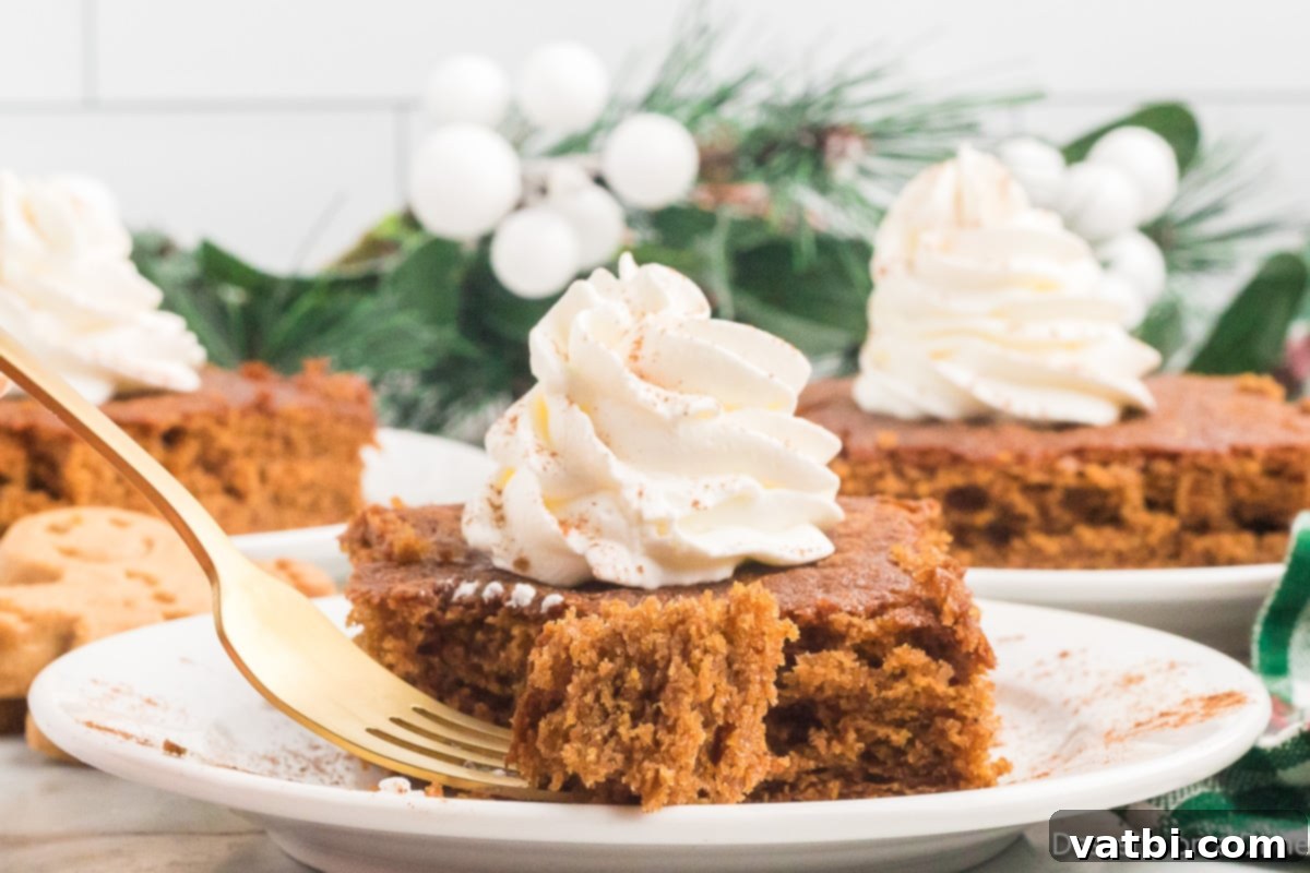 Easy Homemade Gingerbread Cake Ready to Serve Full gingerbread cake in a baking dish, ready to be sliced and served