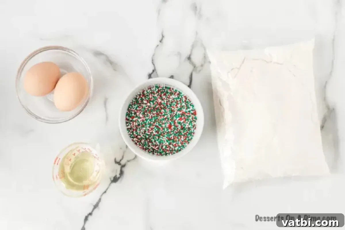 Christmas cake mix cookies make an easy and festive treat with only 4 ingredients. They are so light and fluffy for the perfect dessert. Learn how to make cake mix cookies with sprinkles. This is the best treat. #dessertonadime #ChristmasCakeMixCookies #Recipeseasy4ingredients #xmas #christmascakemixcookieseasy #recipes Ingredients needed: white cake mix, eggs, vegetable oil, red and green sprinkles on a wooden board.