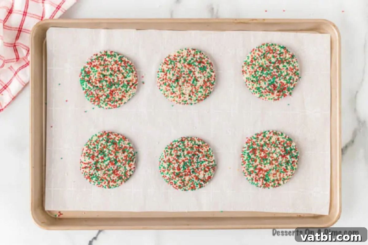 Festive Cake Mix Cookie Delights 4 Cookies placed on a baking sheet, ready to bake.