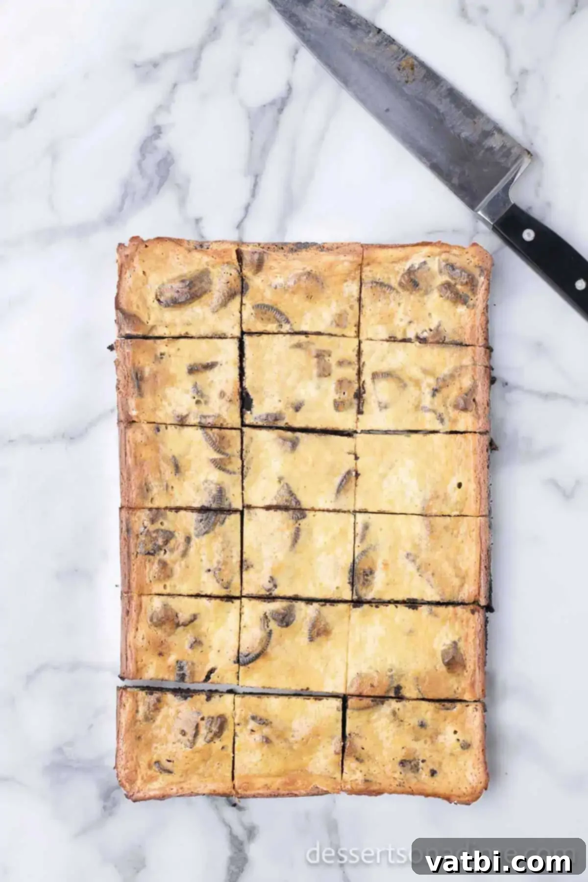 Irresistible Oreo Cheesecake Delight 14 Oreo Cheesecake Bars cut into neat squares, ready for serving.