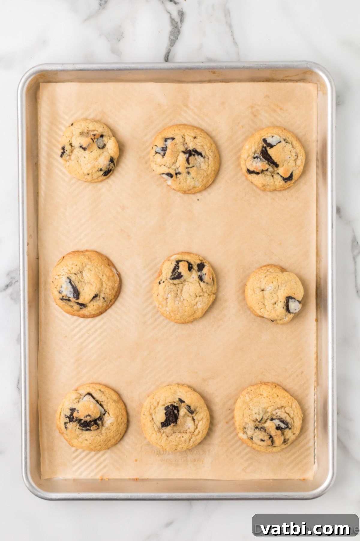 Cookies & Cream Bliss 8 Cookies baked and cooling on baking sheet.