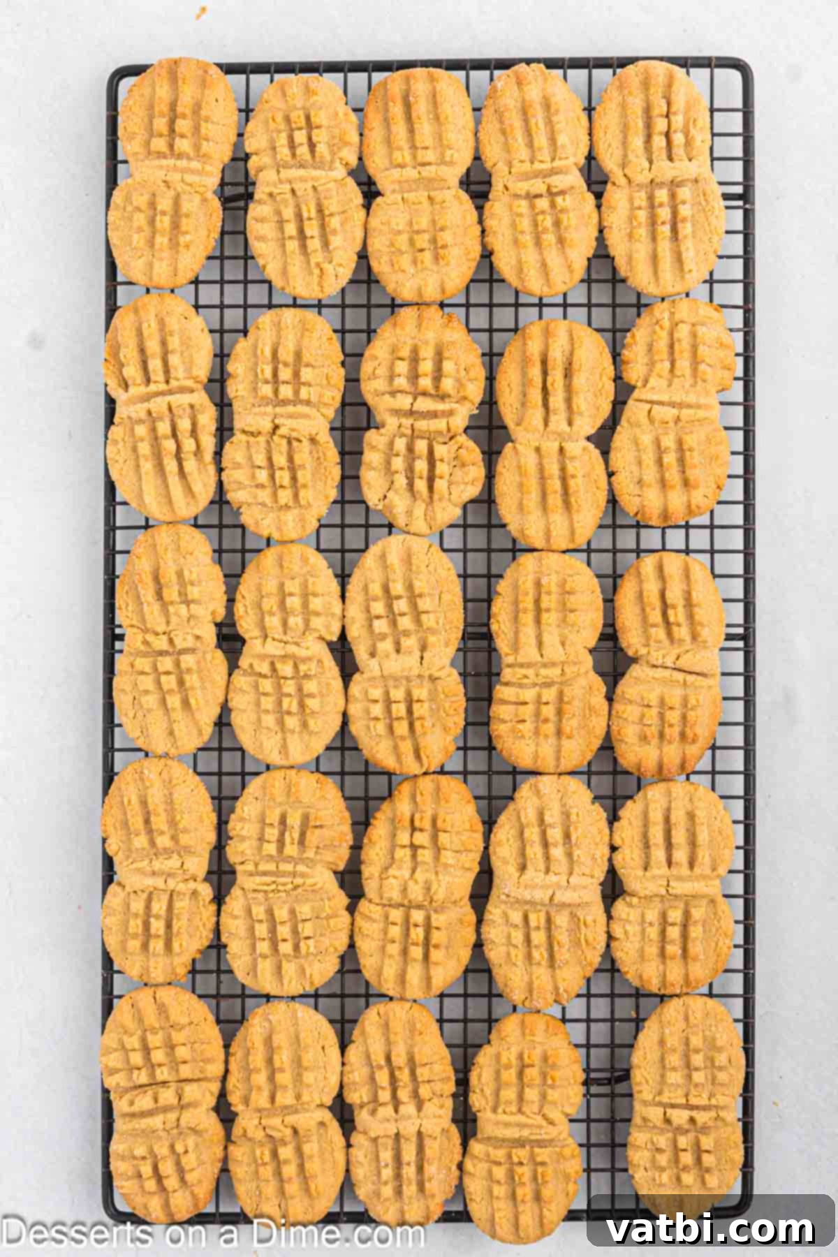 Golden Peanut Perfection 8 Cookies on wire rack.
