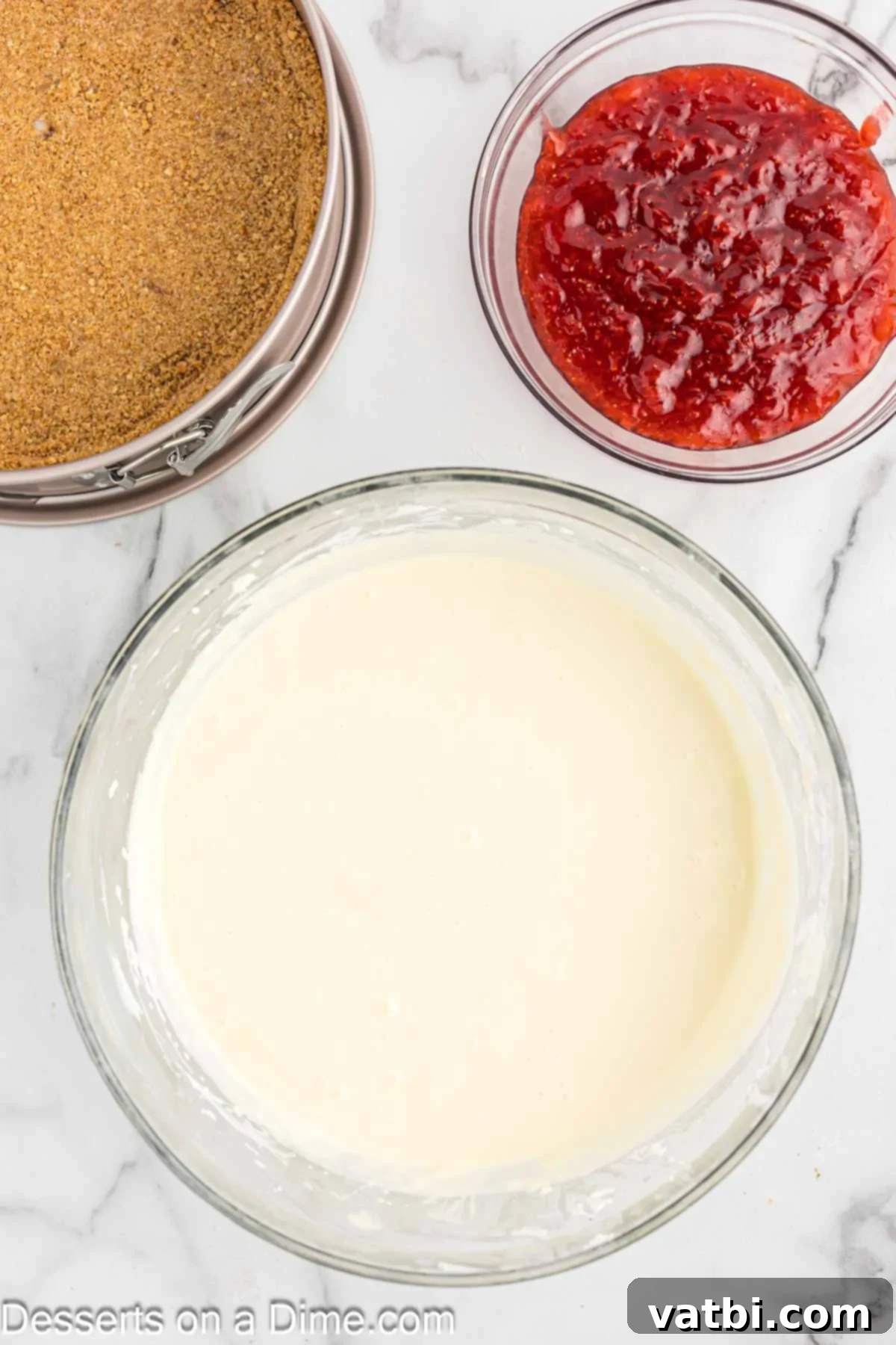 All cheesecake filling ingredients combined in a bowl, smooth and ready.