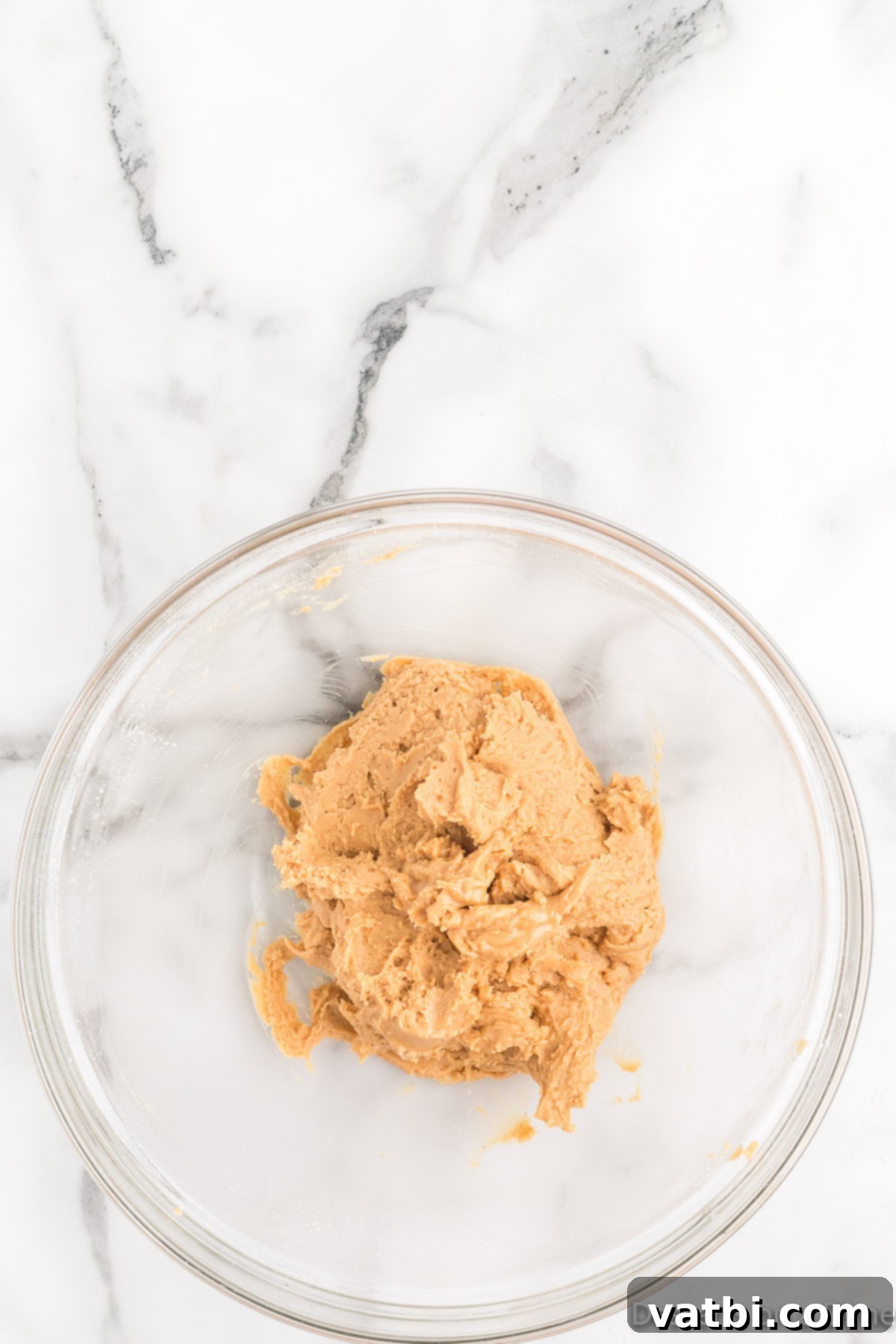 Decadent Homemade Peanut Butter Cups 4 Smooth peanut butter mixture in a mixing bowl, perfectly blended and ready for use.
