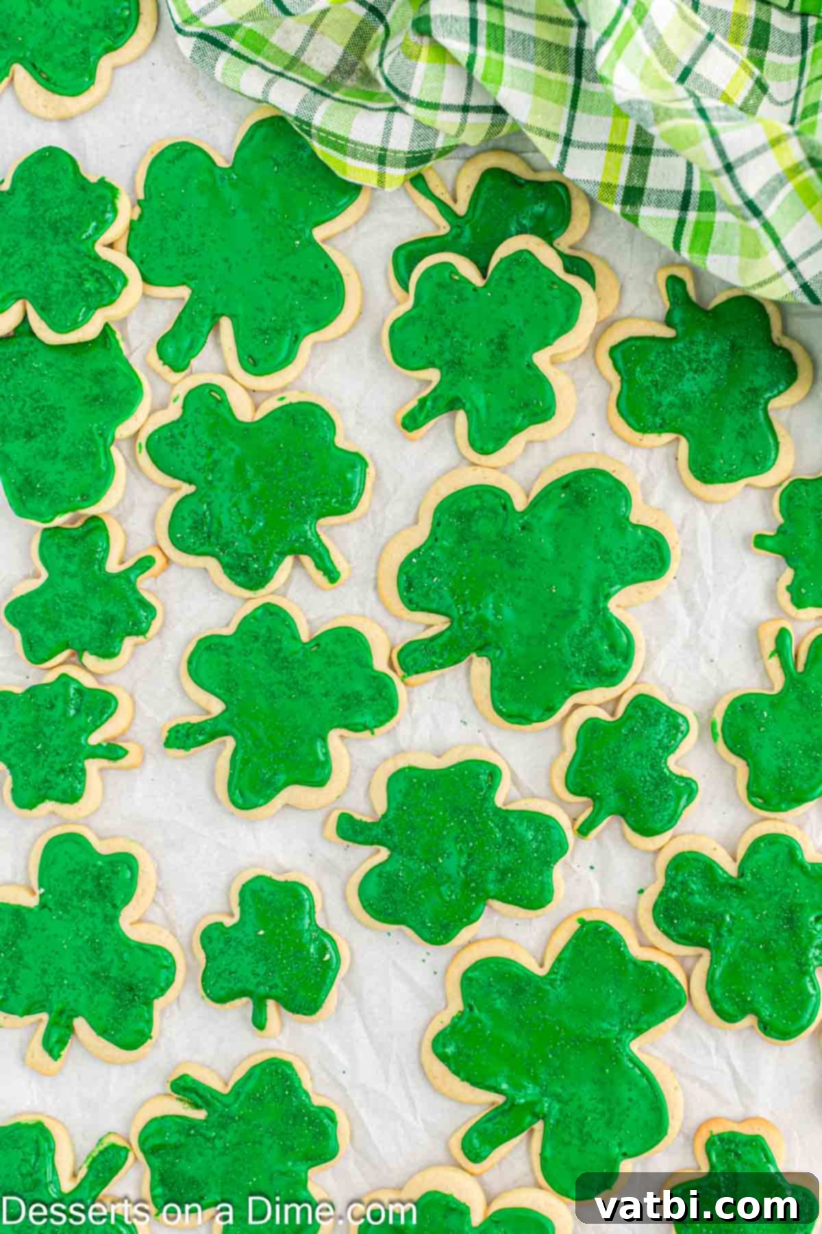 Sweet Clover Delights 15 A beautiful spread of finished shamrock cookies on a counter, artfully arranged and ready to be enjoyed as a festive treat.