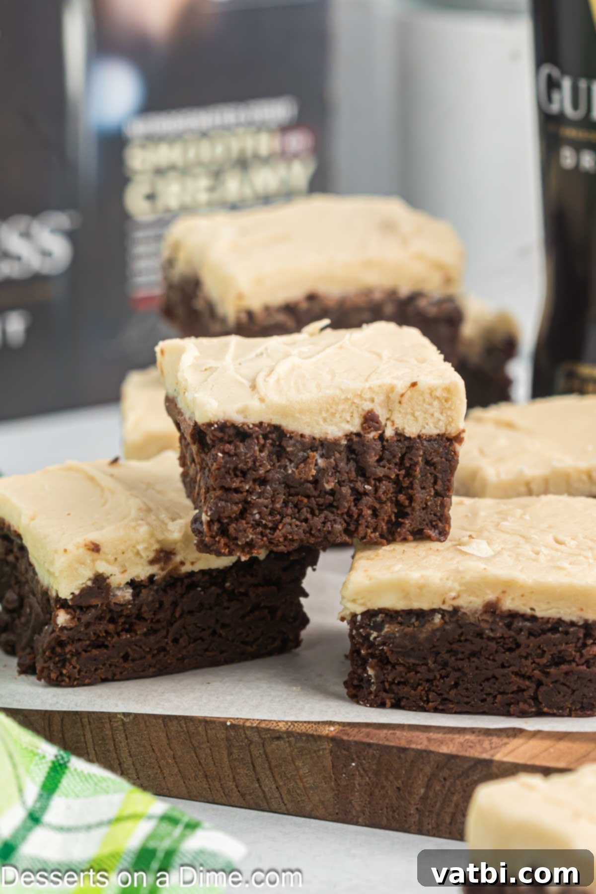 Rich Guinness Chocolate Brownies 2 Squares of Guinness brownies ready to serve on a white plate, showcasing their rich color and fudgy texture.