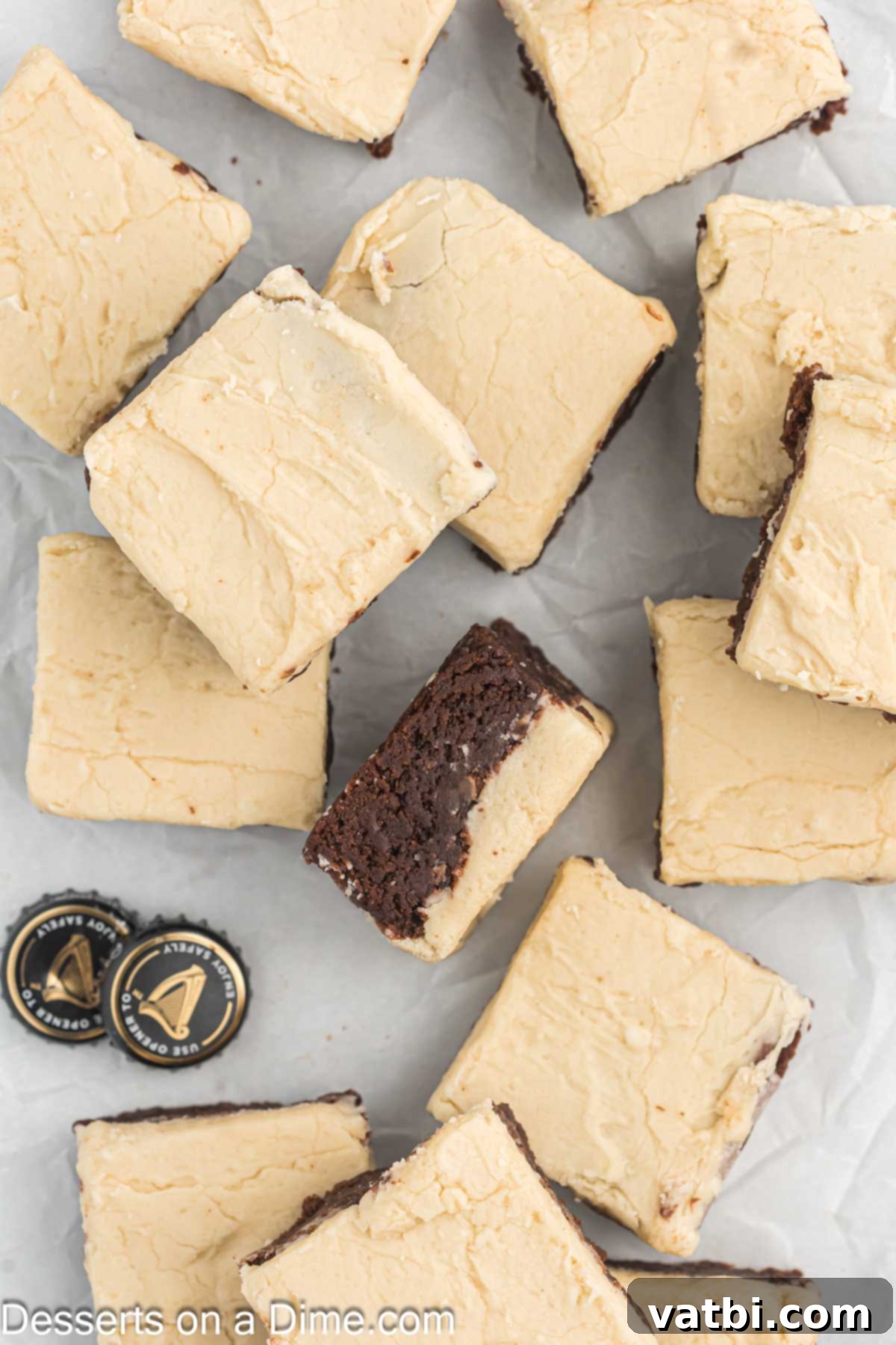 Rich Guinness Chocolate Brownies 11 Frosted Guinness brownies lifted from the pan using parchment paper and cut into neat square bars.