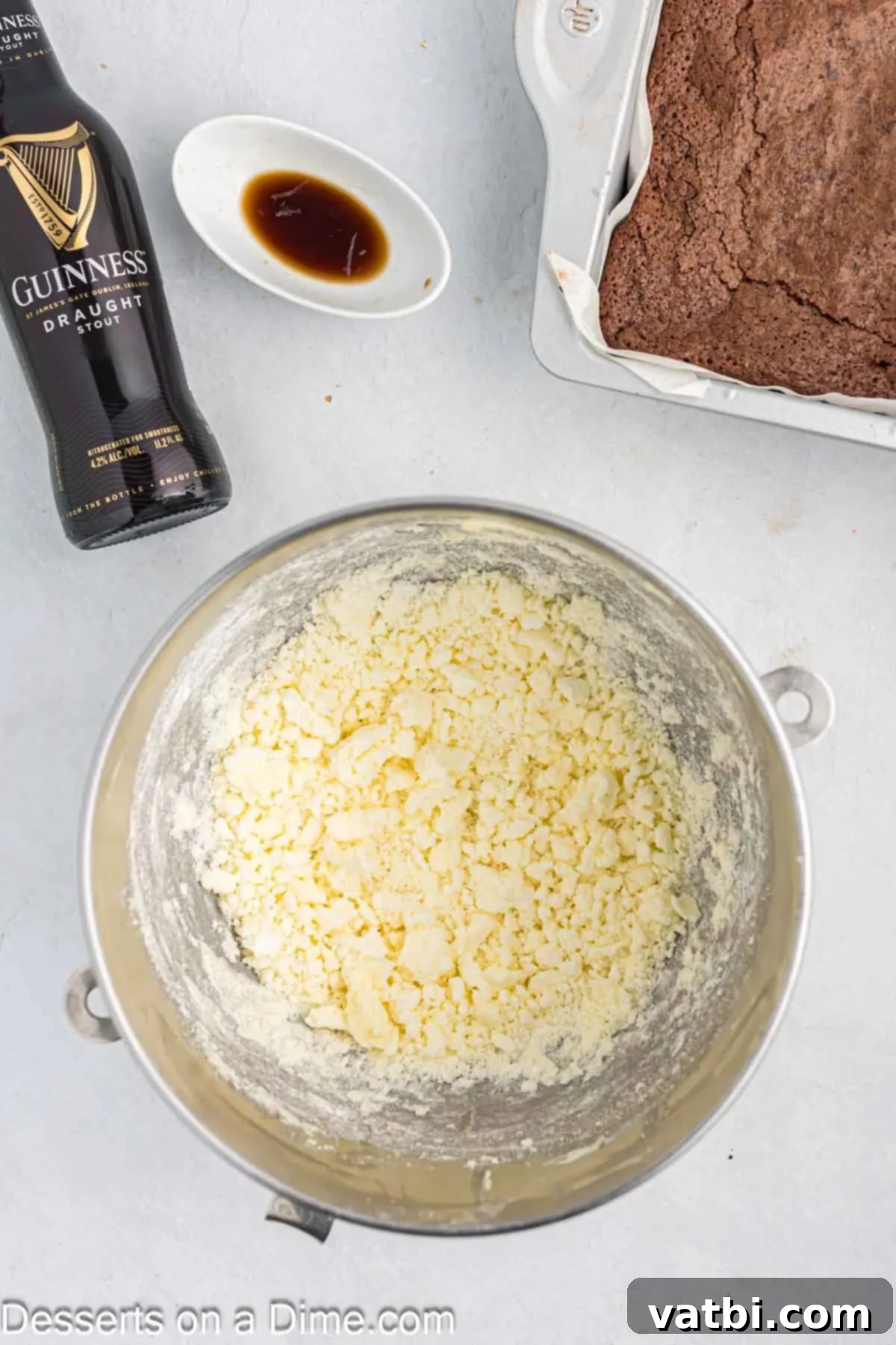 Rich Guinness Chocolate Brownies 8 Softened unsalted butter being beaten in a stand mixer bowl until it becomes light and fluffy.