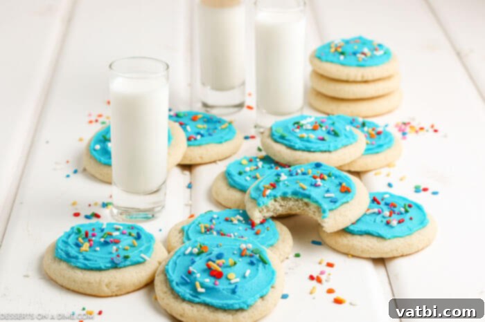 Cookies topped with frosting and sprinkles. 