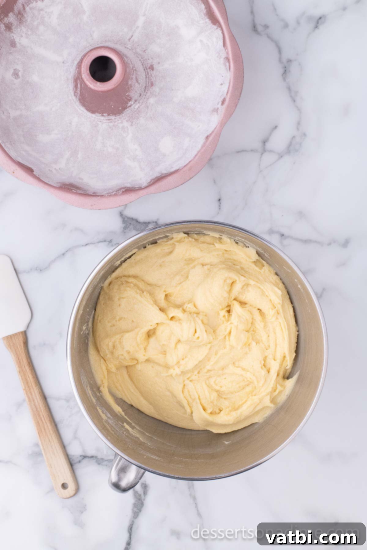 Effortless Pound Cake Perfection 6 Mixing bowl with perfectly combined pound cake batter, smooth and ready for the pan.
