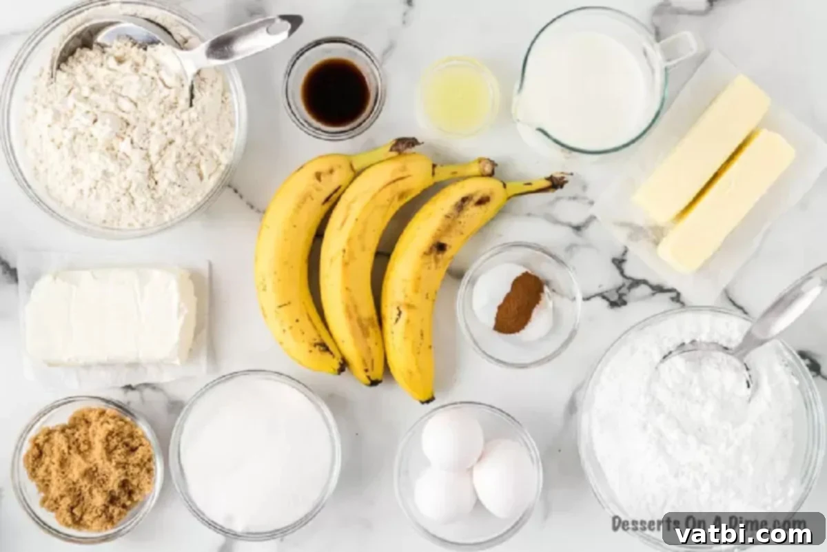 A selection of fresh ingredients laid out on a table, including ripe bananas, flour, baking soda, ground cinnamon, salt, butter, granulated sugar, brown sugar, eggs, vanilla extract, milk, and lemon for a homemade banana cake.