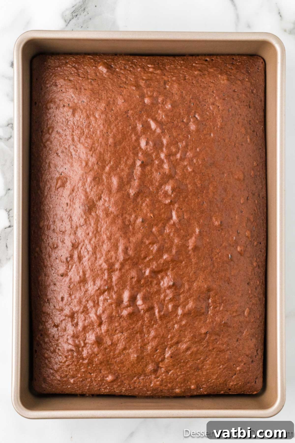 Irresistible Chocolate Trifle 3 A baked and cooled chocolate cake in a 13x9 inch pan, ready for cubing.
