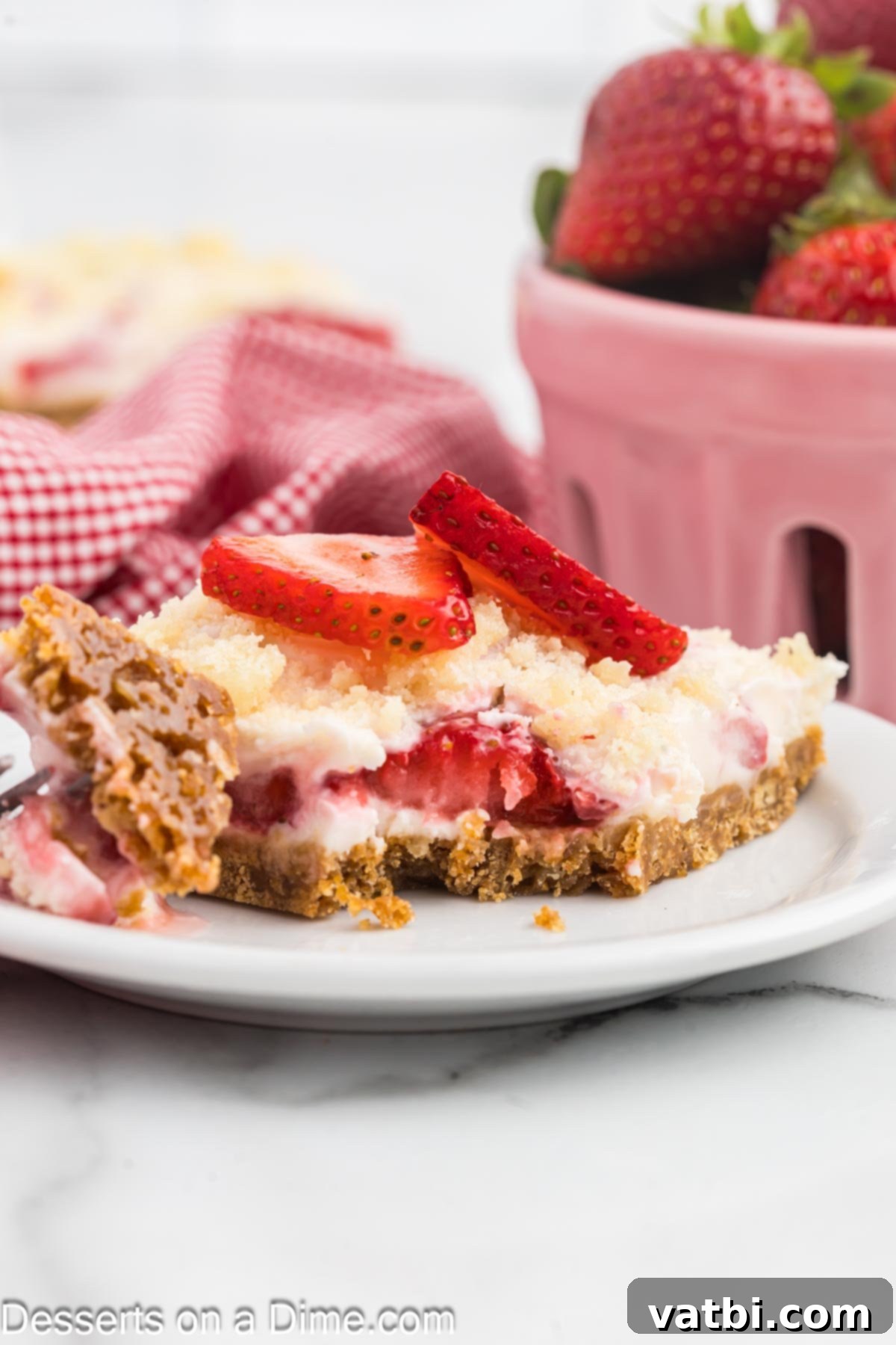 Easy Strawberry Crunch Bars 11 Strawberry Crunch Bars with the topping sprinkled over them, ready to chill.