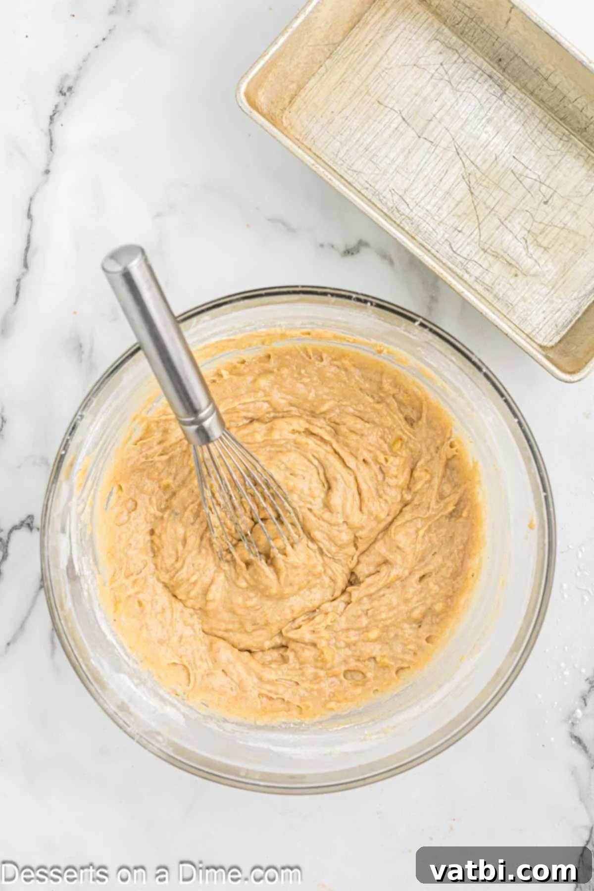 Brown Sugar Banana Bread 6 Mixing bowl with flour mixture added to wet ingredients.