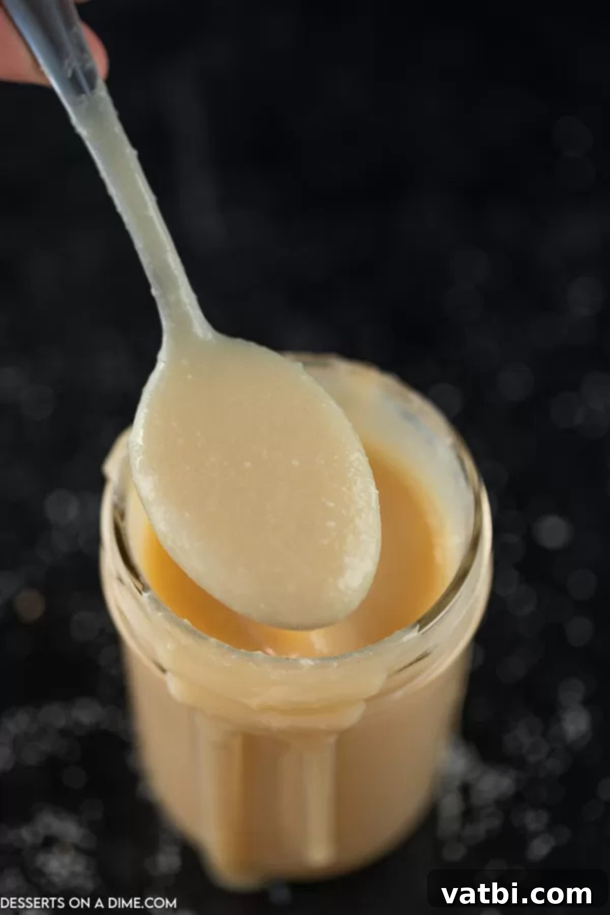 Homemade sweetened condensed milk is simple to make at home. Skip the store bought stuff and make this simple 4 ingredient recipe at home. Homemade Sweetened Condensed Milk in a mason jar with a spoon
