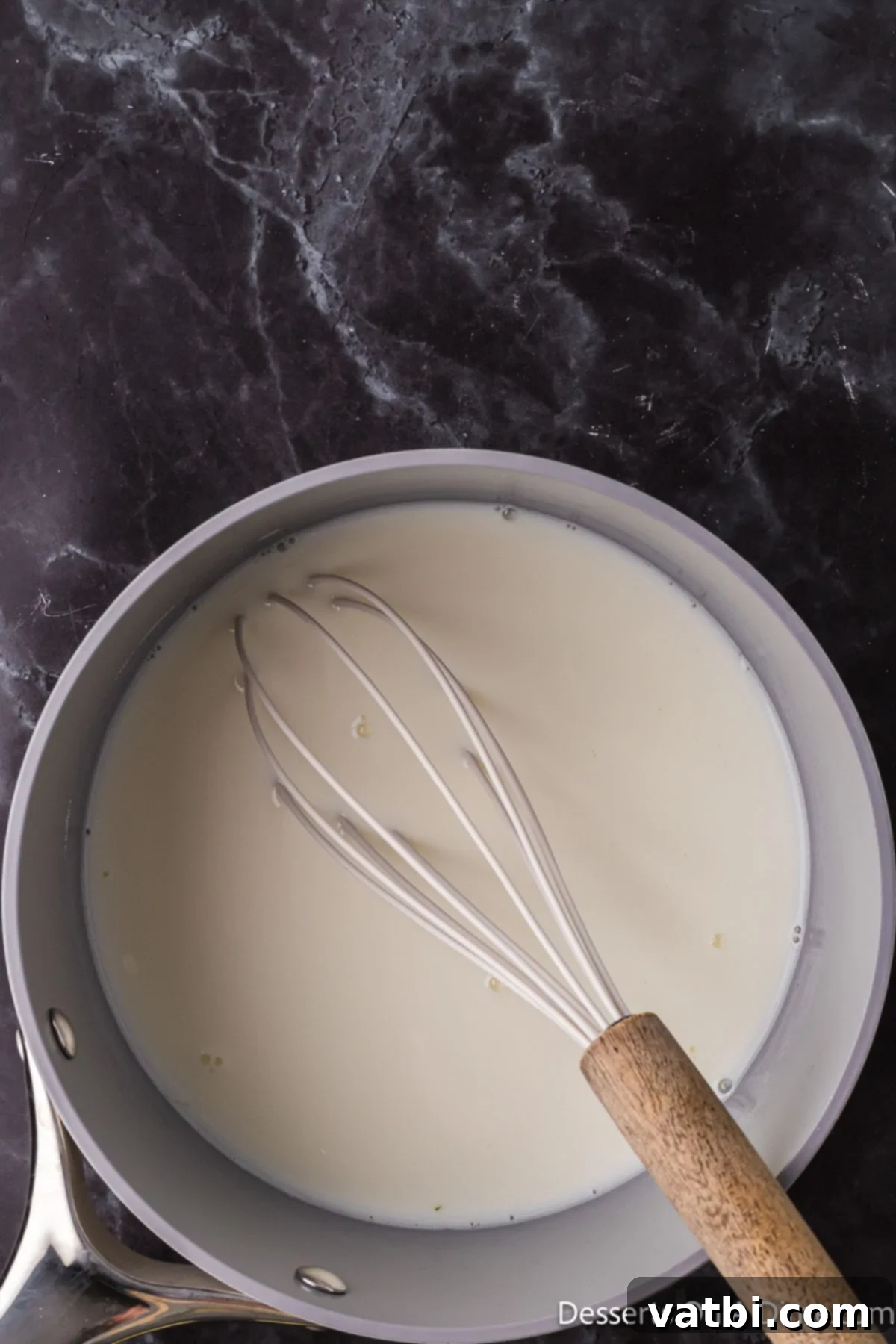 Sweetened Condensed Milk From Scratch 2 Saucepan with milk and sugar.