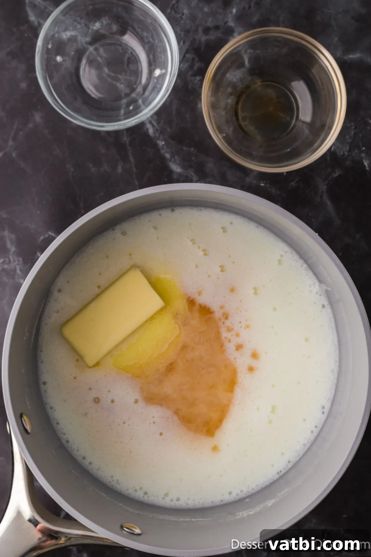 Sweetened Condensed Milk From Scratch 3 Saucepan with butter and vanilla added.