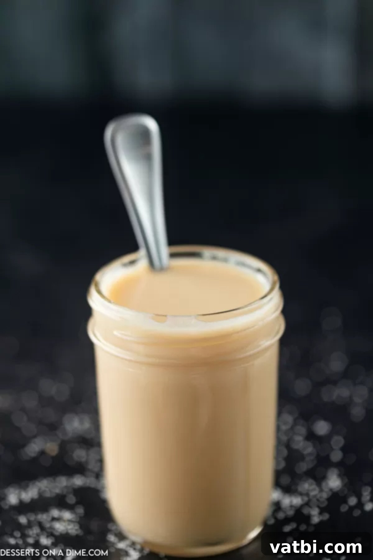 Homemade sweetened condensed milk is simple to make at home. Skip the store bought stuff and make this simple 4 ingredient recipe at home. Homemade Sweetened Condensed Milk in a mason jar with a spoon