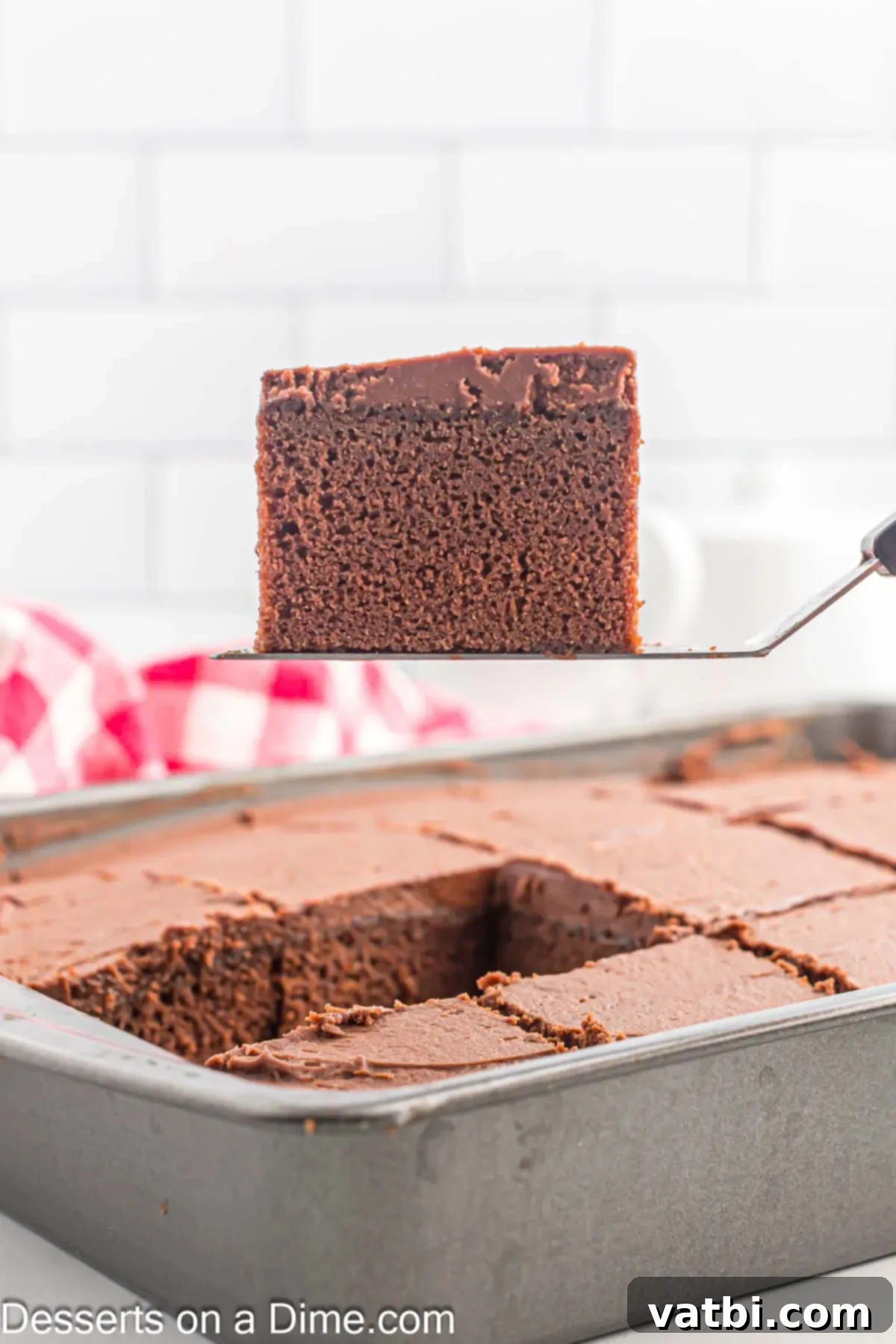 Effortless Chocolate Delight 10 A beautifully frosted chocolate cake being sliced into servings.