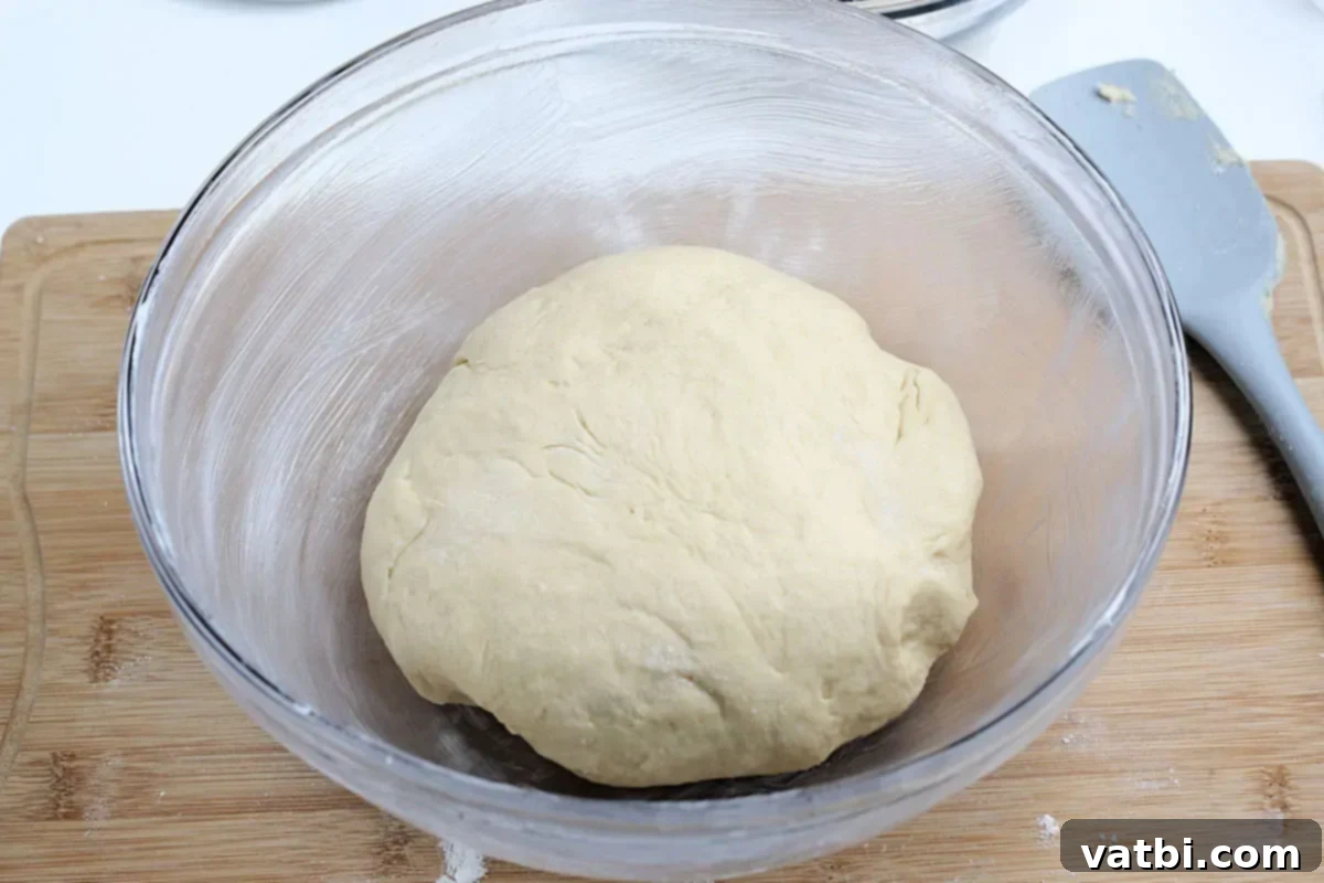 Homemade Mardi Gras King Cake 4 Dough in a bowl, beginning its first rise.