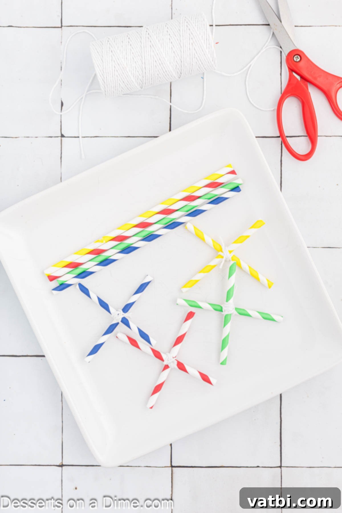 Grow Your Own Rock Candy Crystals 12 Multiple rock candy skewers hanging from an X-shaped straw drying rack over a plate.