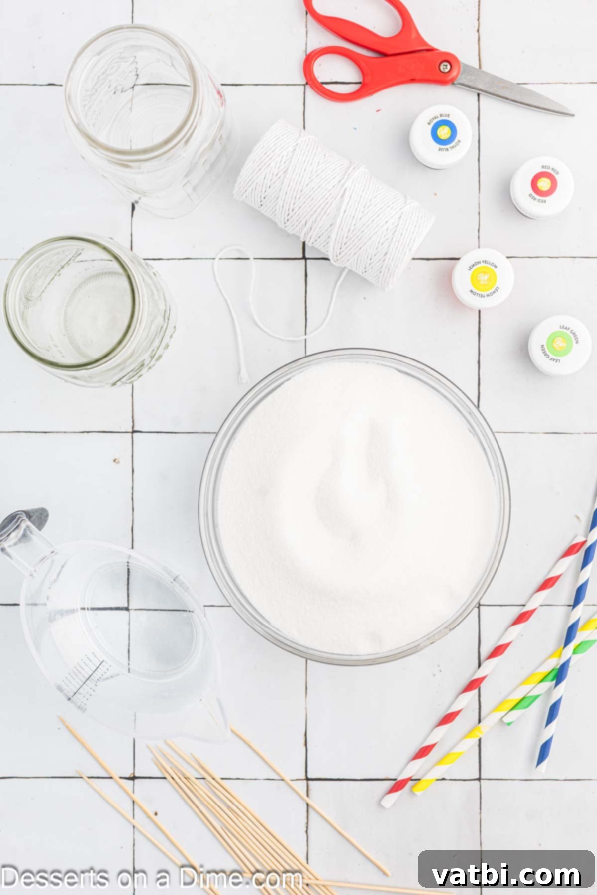 Grow Your Own Rock Candy Crystals 3 Ingredients for Rock Candy - granulated sugar, food coloring, and flavoring oil, neatly arranged for preparation.