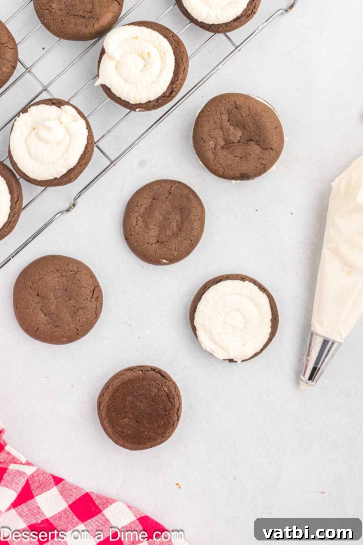 Decadent Whoopie Pies 11 Frosting piped on each cookie to make a sandwich.
