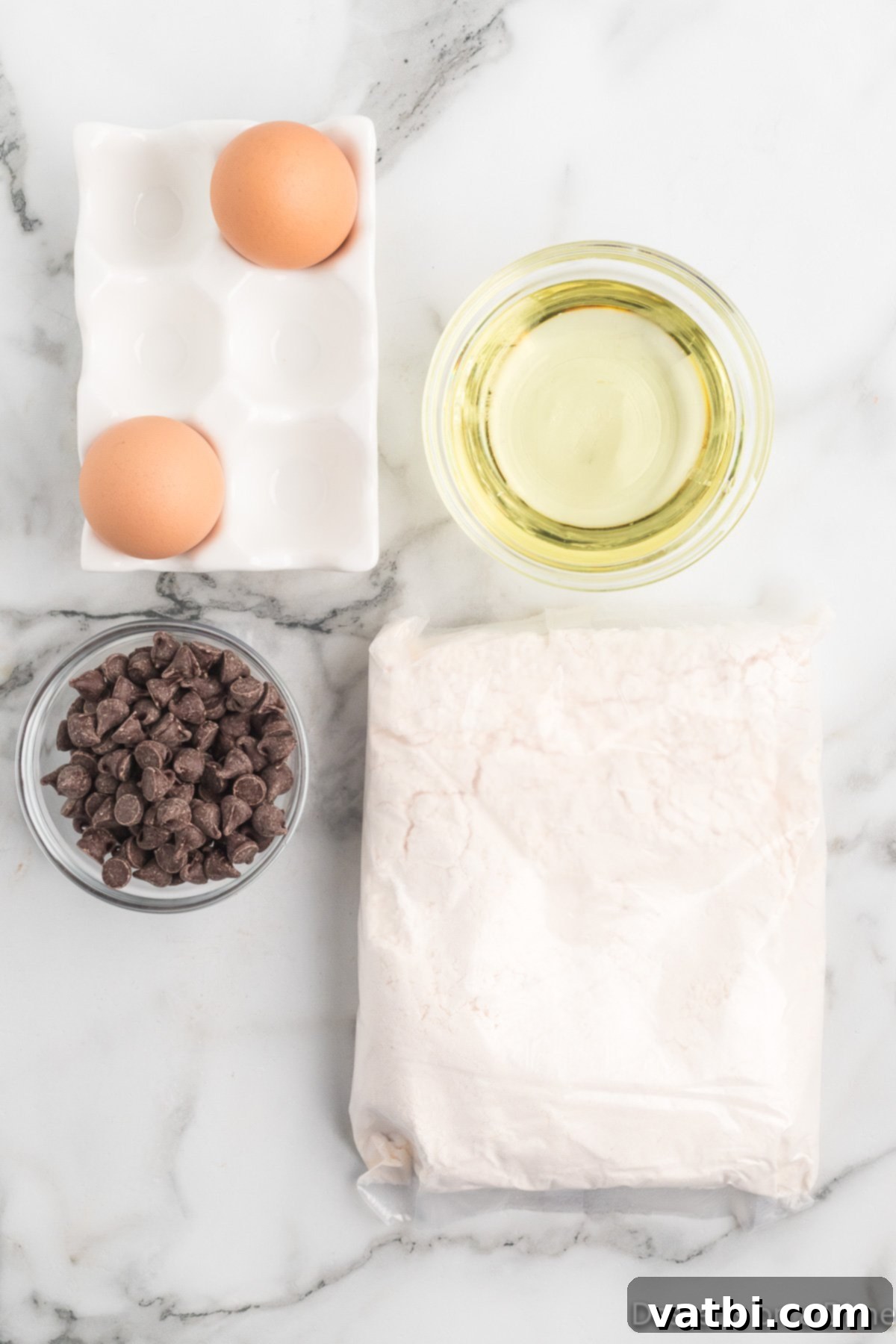 Perfect Chocolate Chip Cake Mix Cookies 3 The essential ingredients for chocolate chip cake mix cookies: a box of yellow cake mix, vegetable oil, eggs, and semi-sweet chocolate chips.