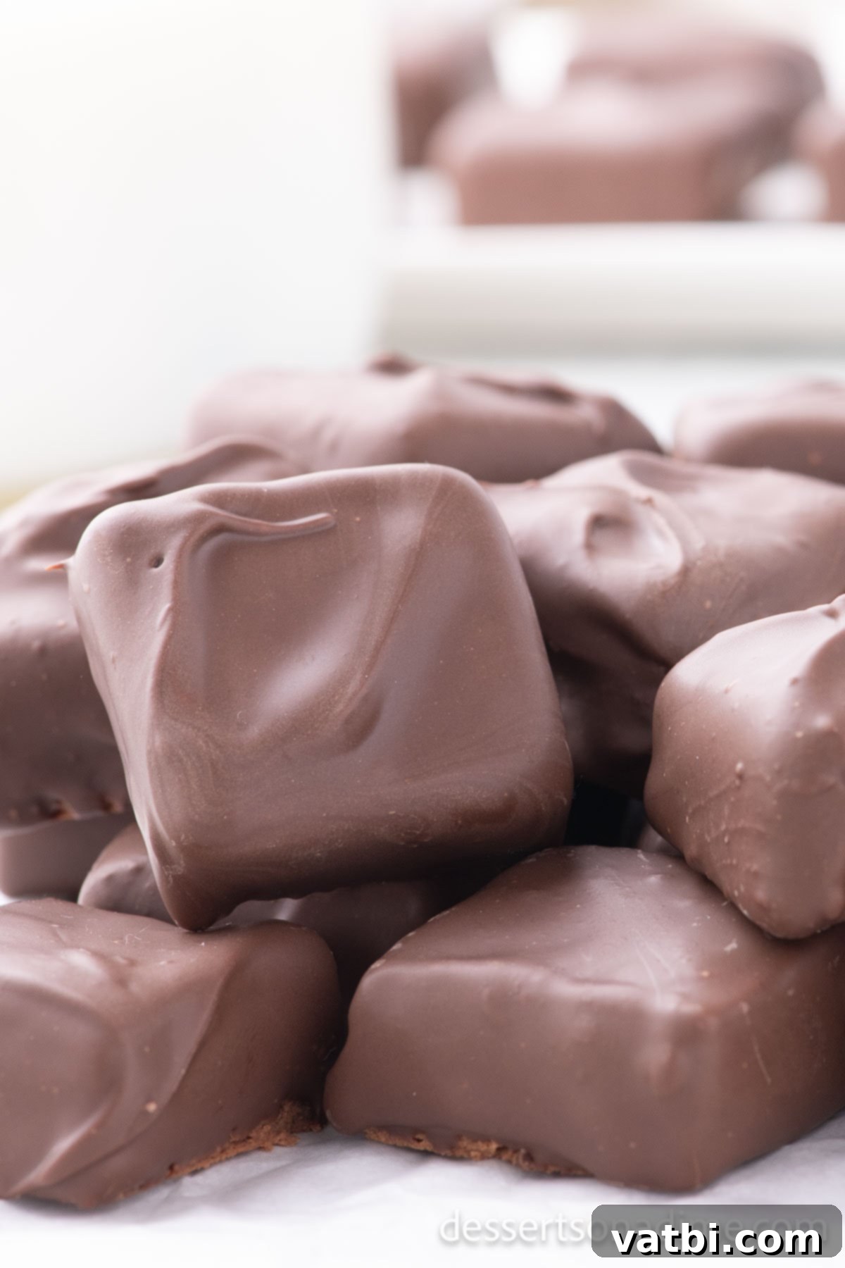 A close-up of finished Cool Whip Candy, perfectly coated in chocolate and ready to eat.