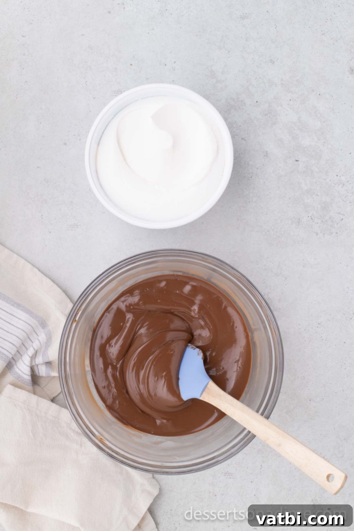 Melted chocolate chips in a bowl, smooth and ready for the next ingredient.