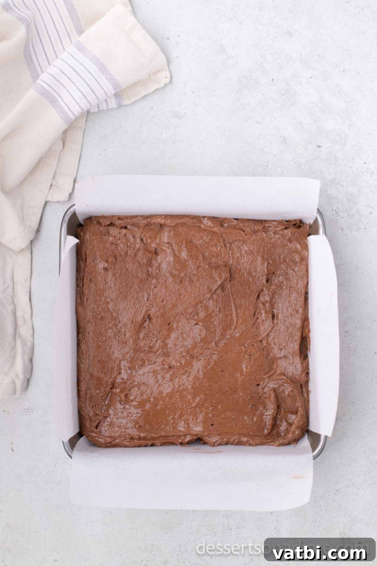Chocolate mixture evenly spread in the pan, ready for freezing.