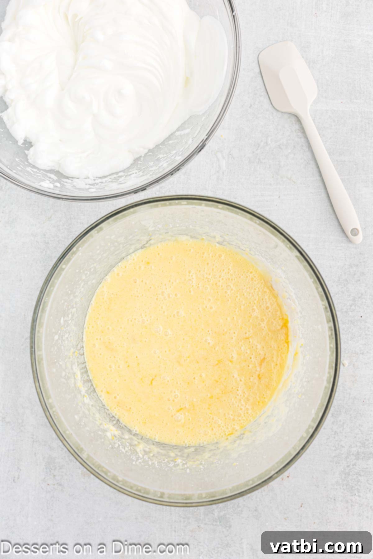 Zesty Lemon Pudding Cake 6 Mixing milk, flour, lemon juice, and lemon zest into the batter in a bowl.