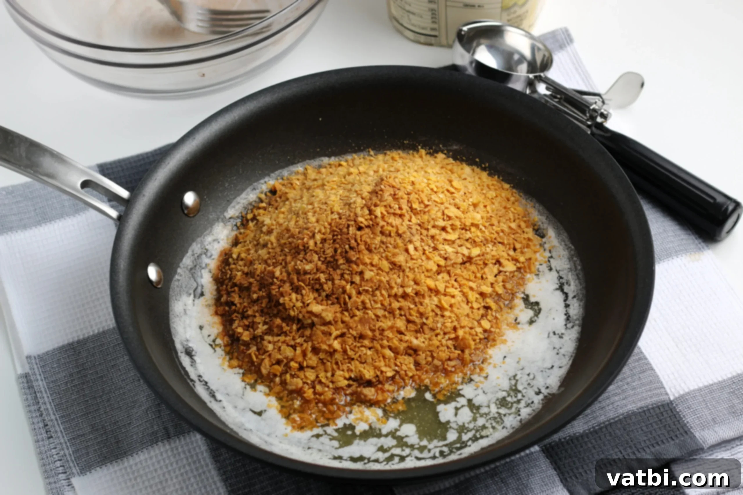 Crispy Cream Dream 3 Skillet of melted butter with cereal crumbs.
