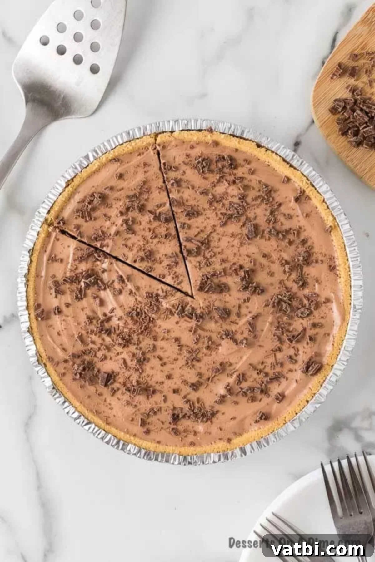 Overview of the No Bake Hershey Pie with one perfectly cut slice slightly separated, showing the clean edges and smooth filling.