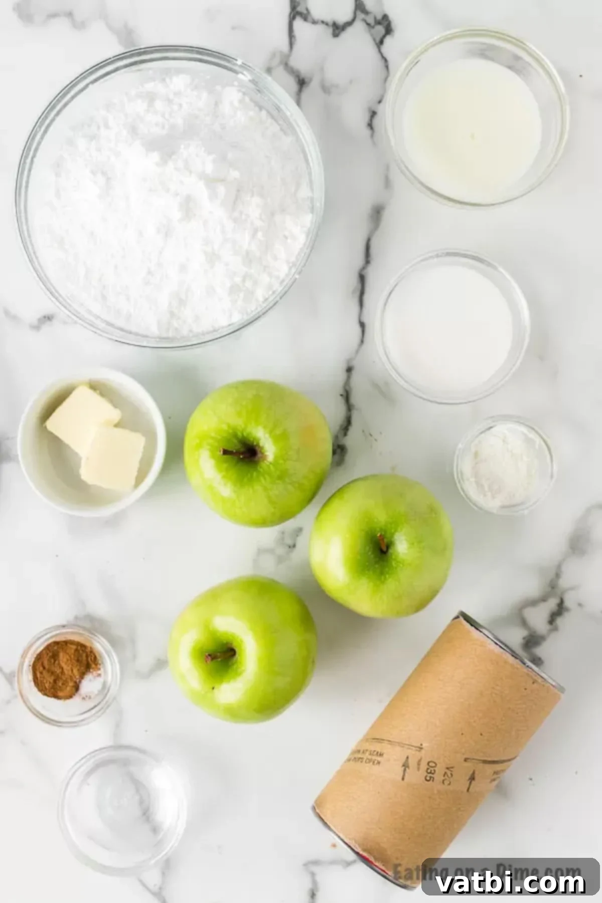 Fried apple pies recipe made with biscuit dough and a delicious apple filling come together for the best dessert. Top it off with glaze! Ingredients needed for the fried apple pies - canned biscuits, powdered sugar, butter, apples, spices.