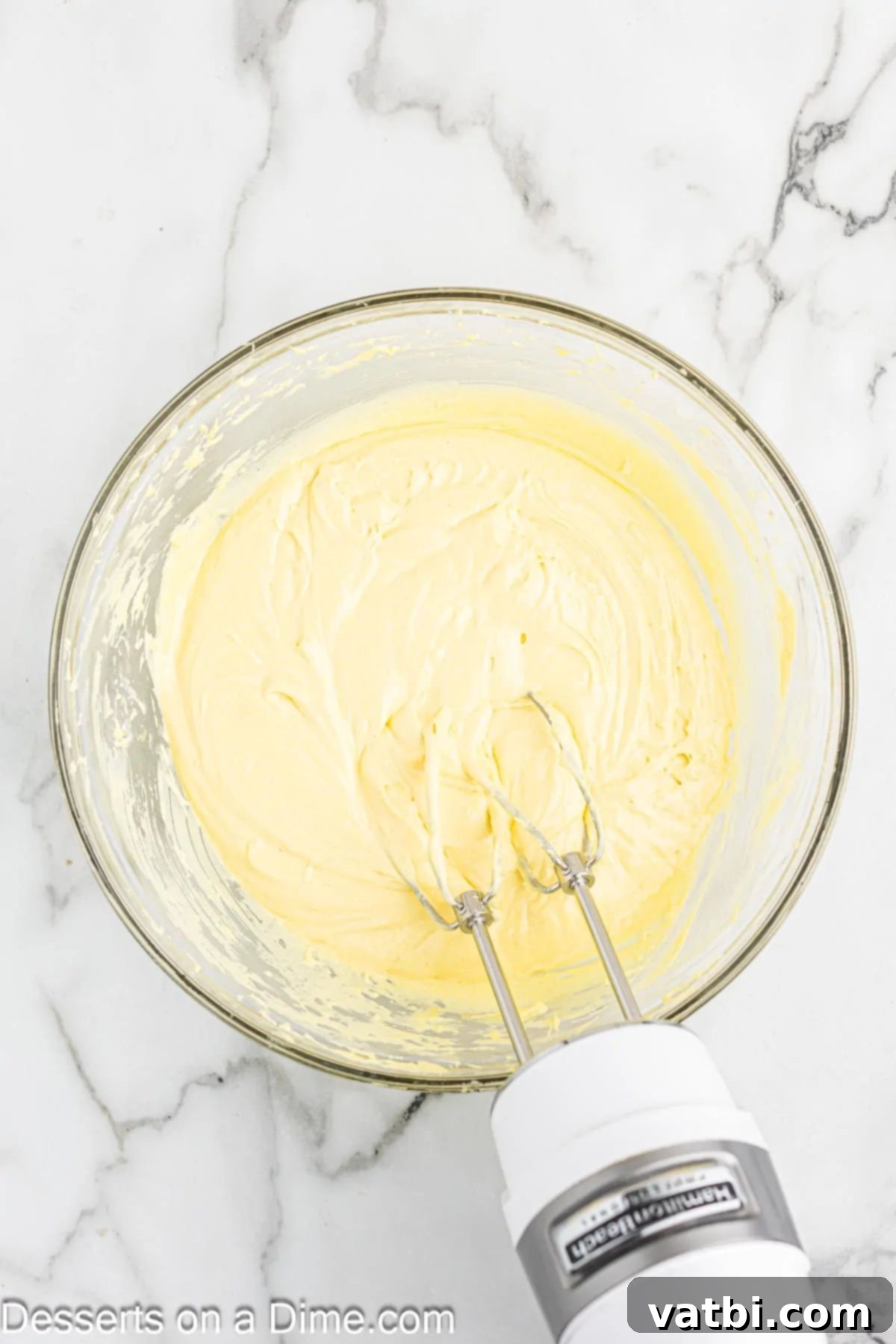 Mixing the cake batter ingredients in a large bowl.