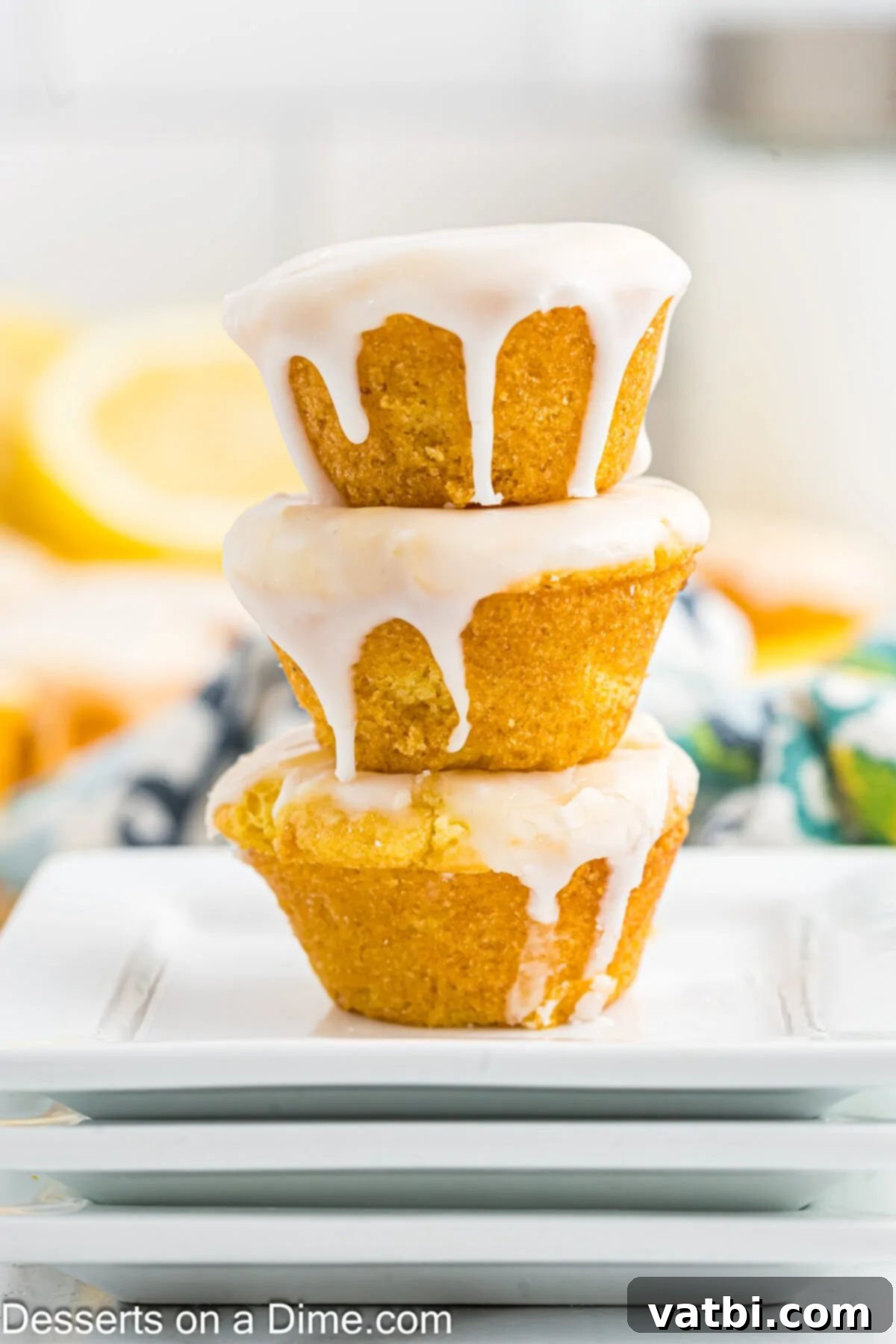 A close-up of a stack of Lemon Blossoms with the glaze visible.