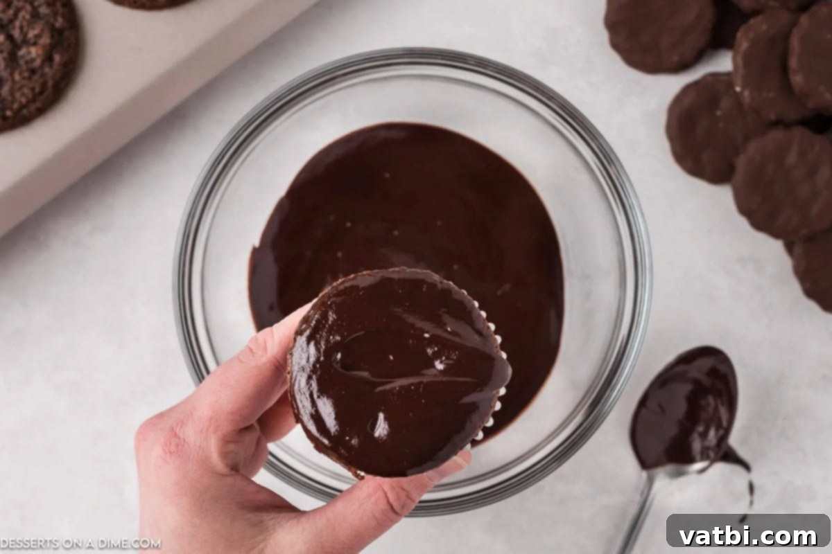 Cupcake dipped into ganache. 