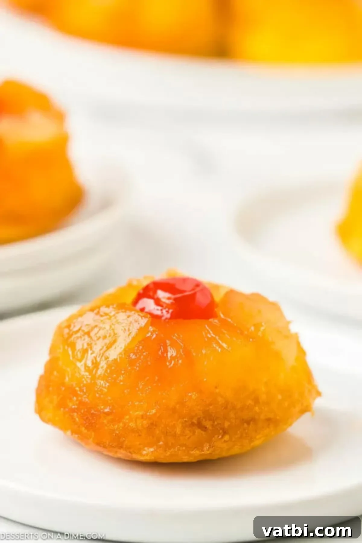 Caramel Pineapple Crown Cupcakes 2 Pineapple Upside Down Cupcakes on a platter
