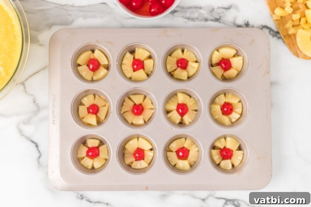 Caramel Pineapple Crown Cupcakes 7 Pineapple slices on top of each muffin tin.