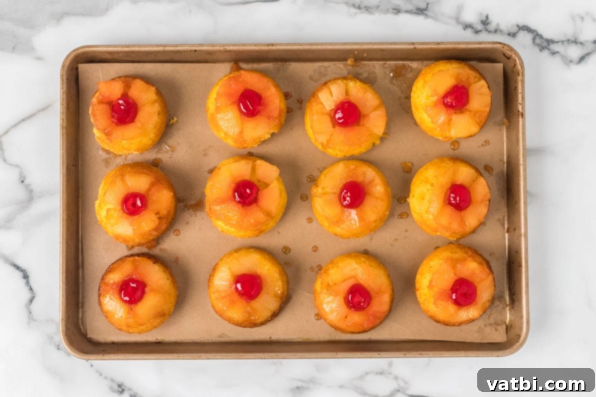 Caramel Pineapple Crown Cupcakes 10 Cupcakes on baking sheet.