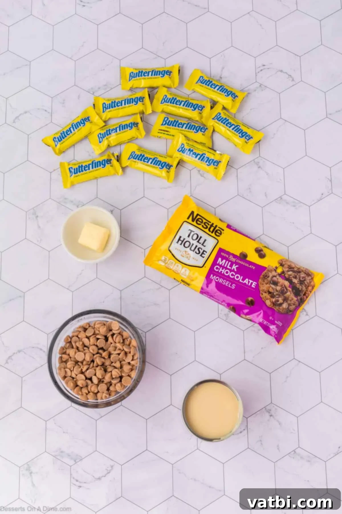 Ingredients for Butterfinger fudge - sweetened condensed milk, butterfinger bars, chocolate chips, peanut butter chips. 